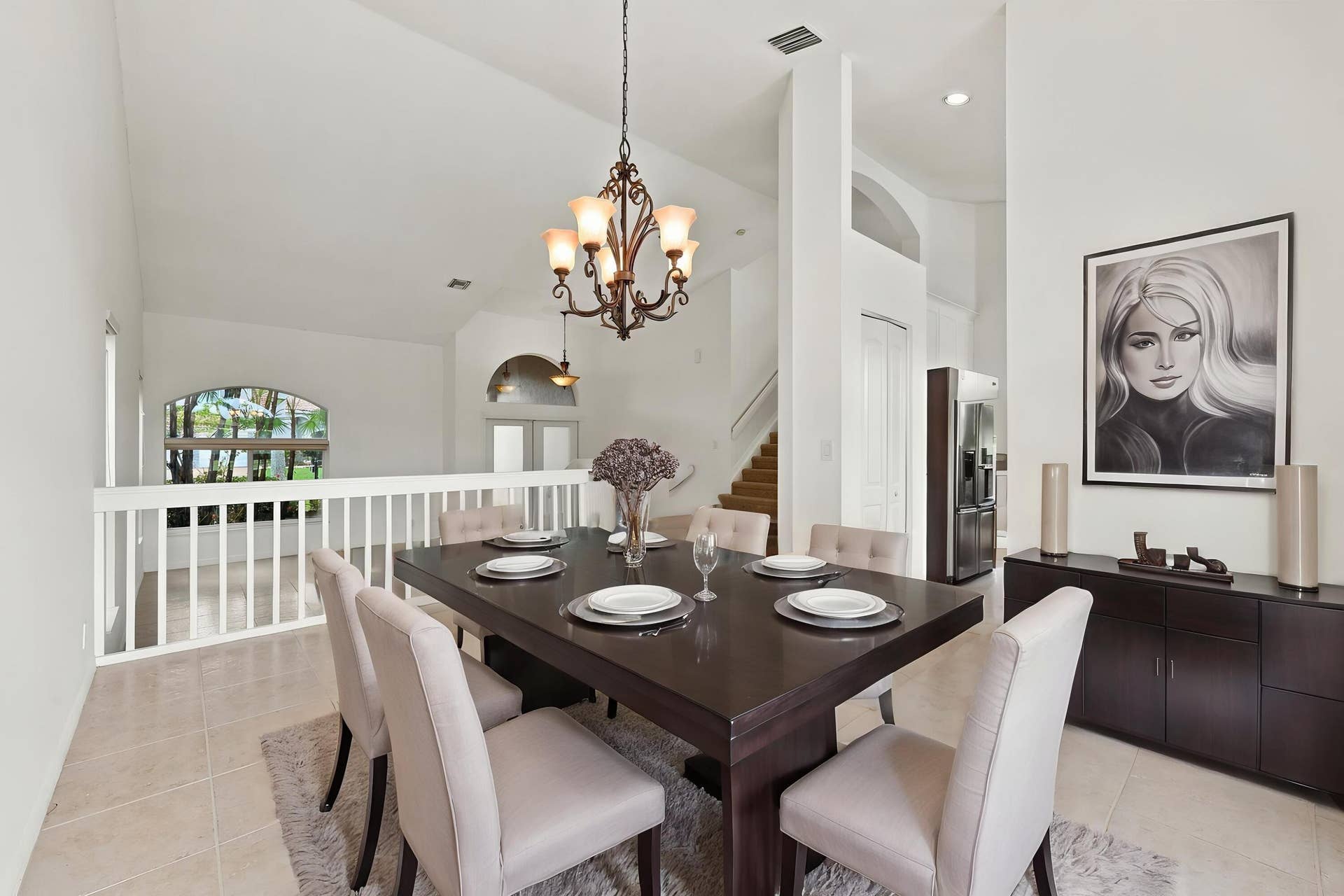 10671 St Thomas Drive, Boca Raton, FL 33498 The formal dining room features impressive ceiling heights, decorative lighting, and an open design that adds to the home's spacious character
