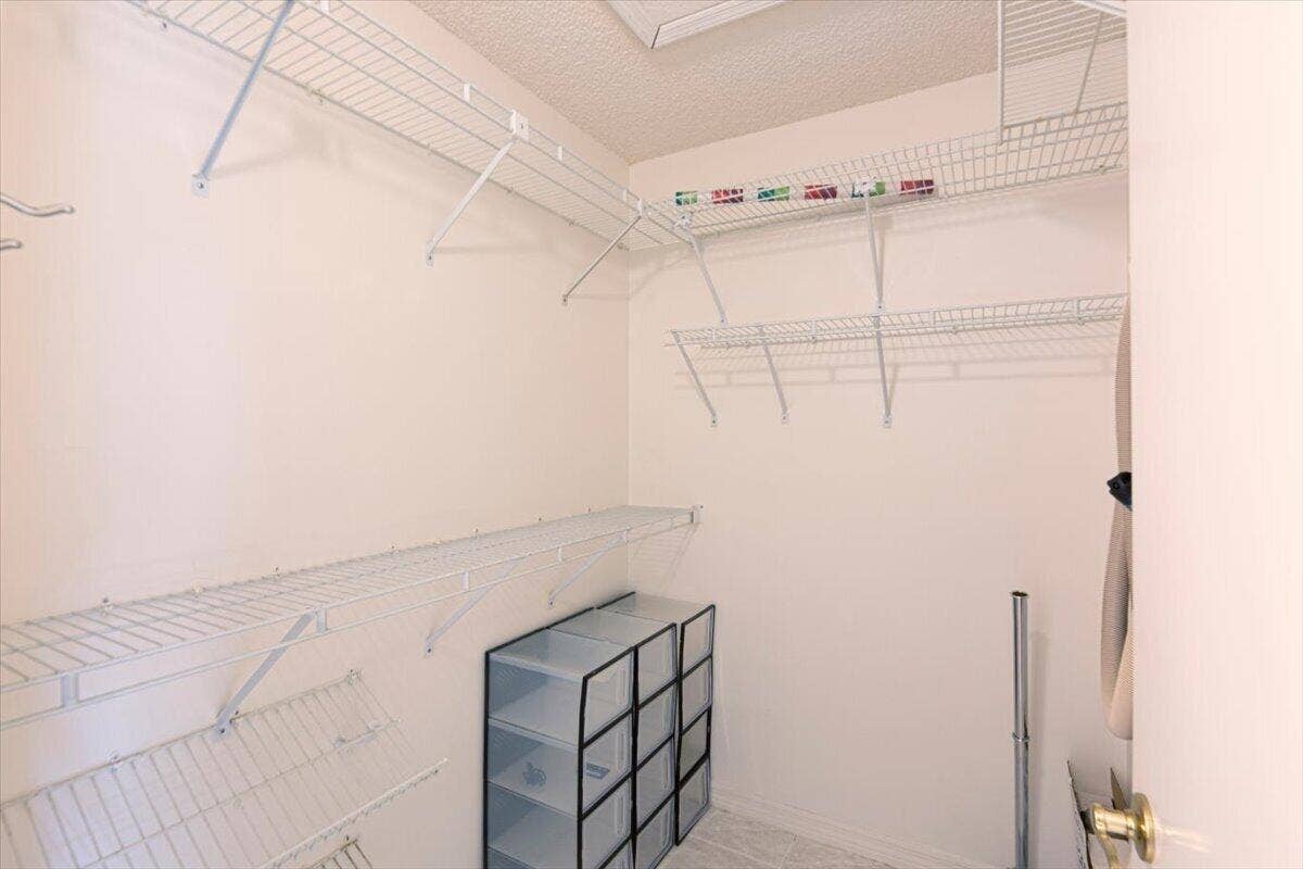 2610 SE Tropical E Circle, Port St Lucie, FL 34952 Master walk in closet