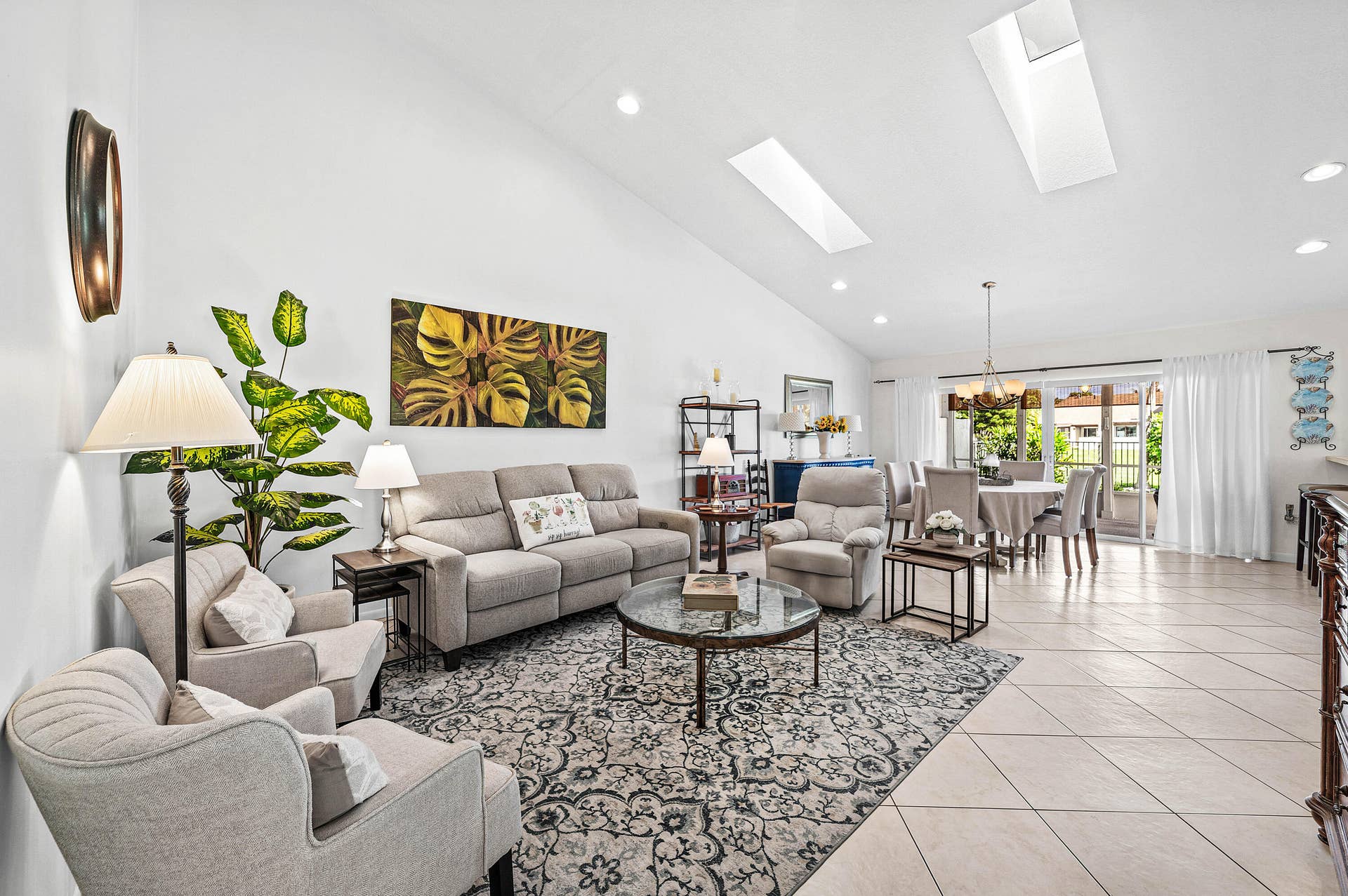 503 SW 29TH Avenue, Delray Beach, FL 33445 Vaulted ceilings featuring dual skylights, recessed lighting, and tile flooring