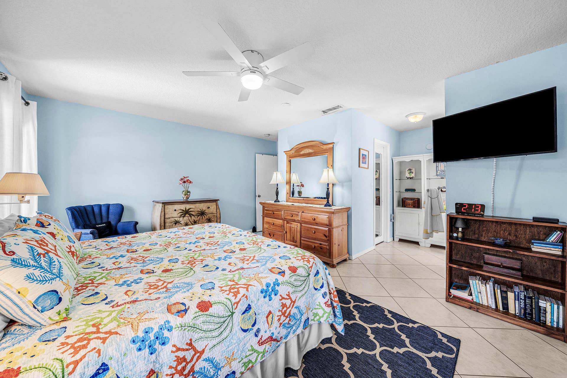 503 SW 29TH Avenue, Delray Beach, FL 33445 Spacious room featuring tile flooring, a central ceiling fan with integrated lighting, and built-in white cabinetry