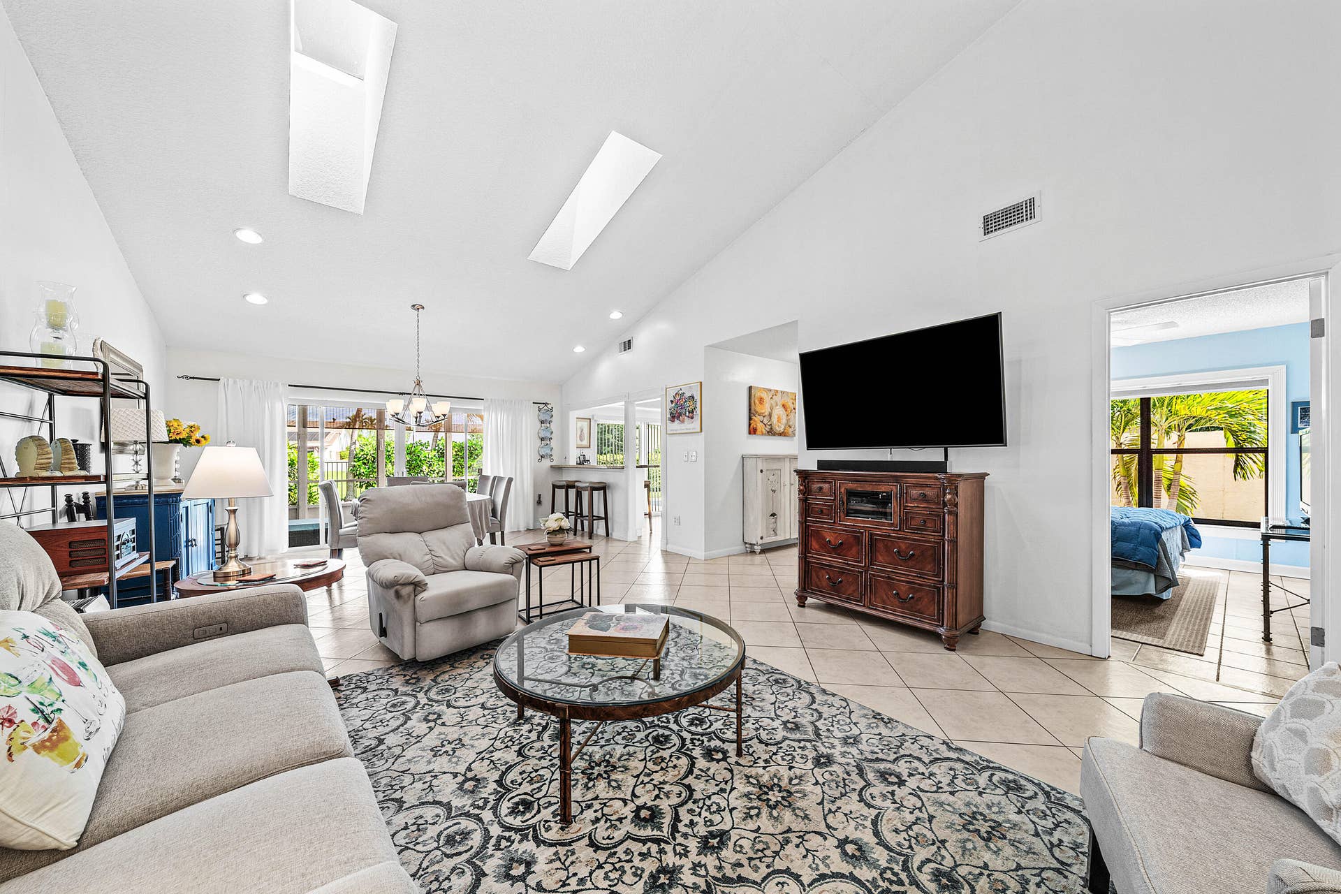 503 SW 29TH Avenue, Delray Beach, FL 33445 Vaulted ceilings with dual skylights, tile flooring, and recessed lighting