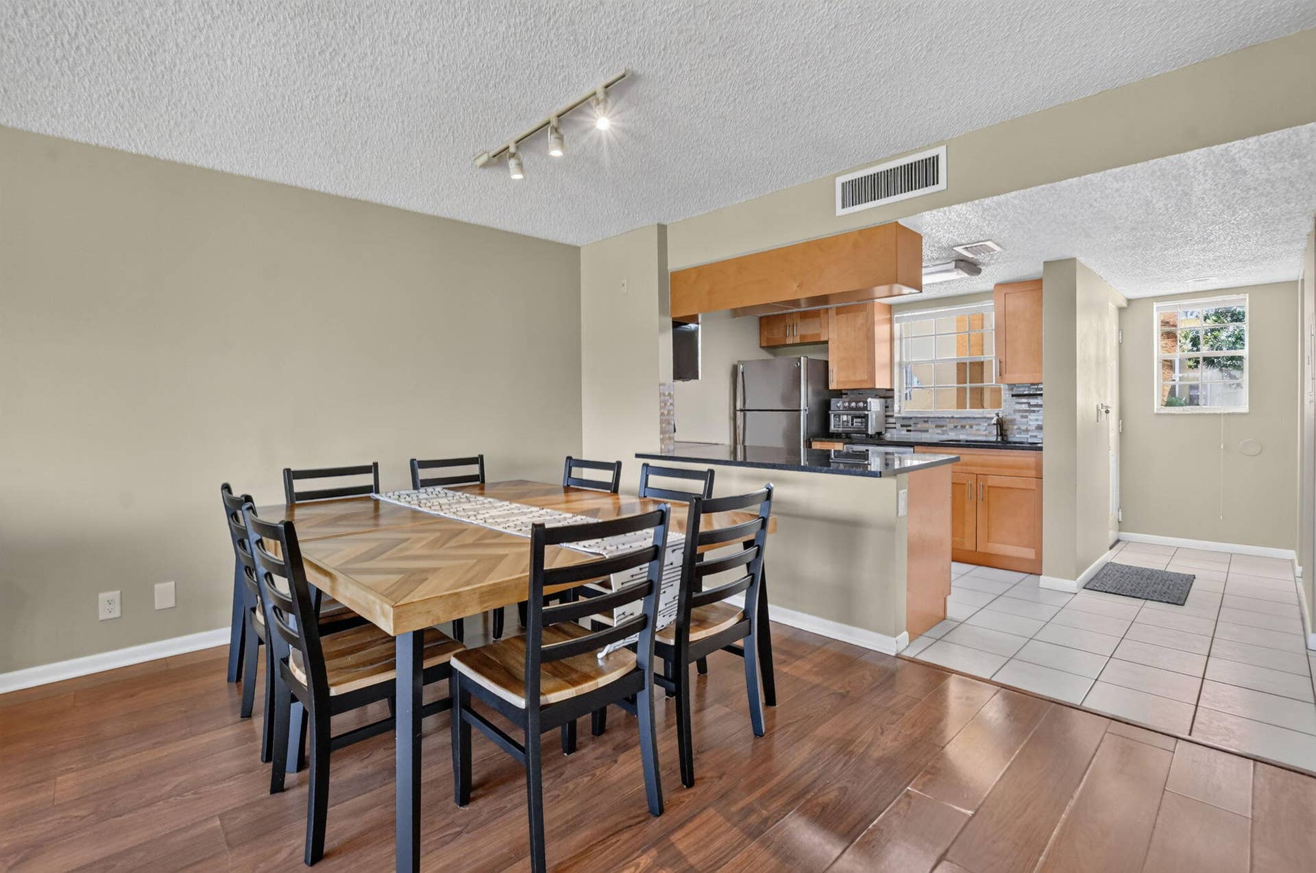 6284 La Costa Drive, #E, Boca Raton, FL 33433 Dining room and open kitchen