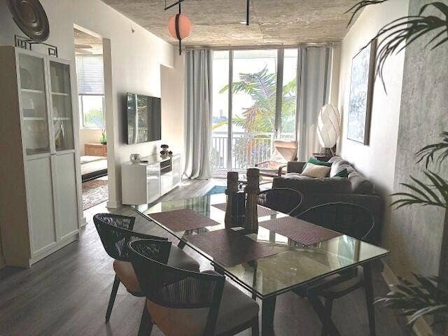 Glass-top expandable Dining table can seat 6 to 8 people.