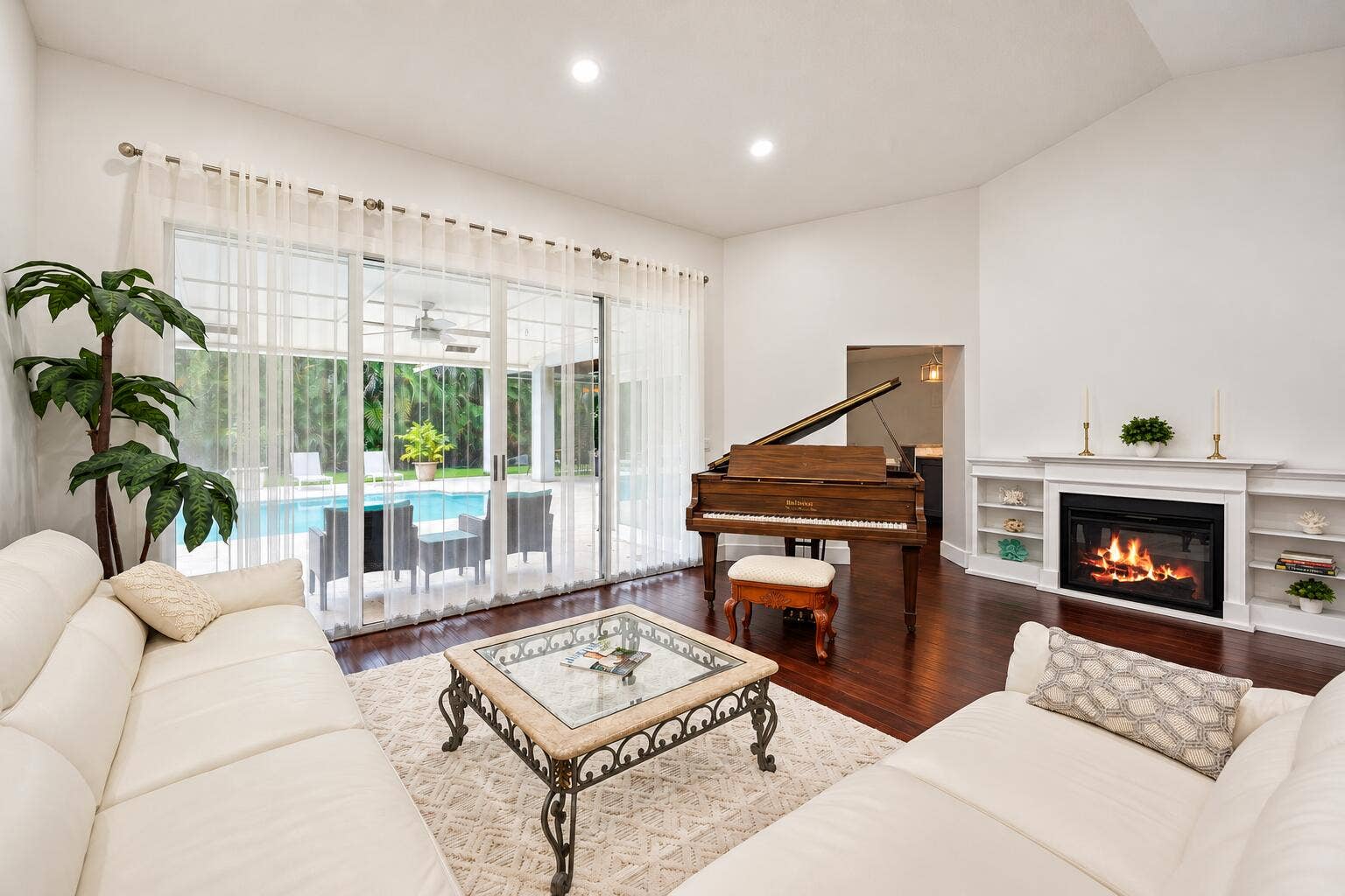 Elegant Living Room with Piano and Pool