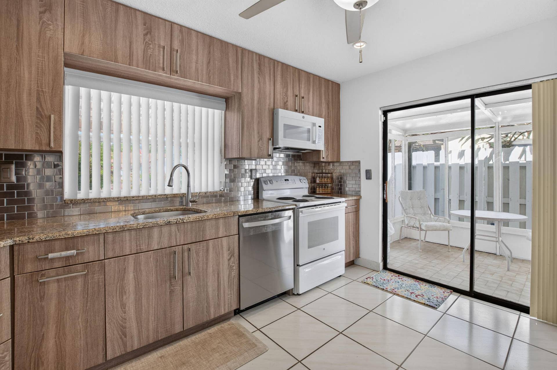 5537 Mirror Lakes Boulevard, Boynton Beach, FL 33472 Features a bonus covered patio located off the kitchen.