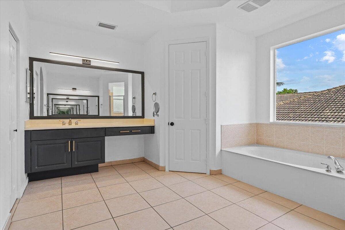1831 Waldorf Drive E, Royal Palm Beach, FL 33411 EN-SUITE BATHROOM WITH ROYAL TUB IN MAIN MASTER SUITE ON SECOND FLOOR