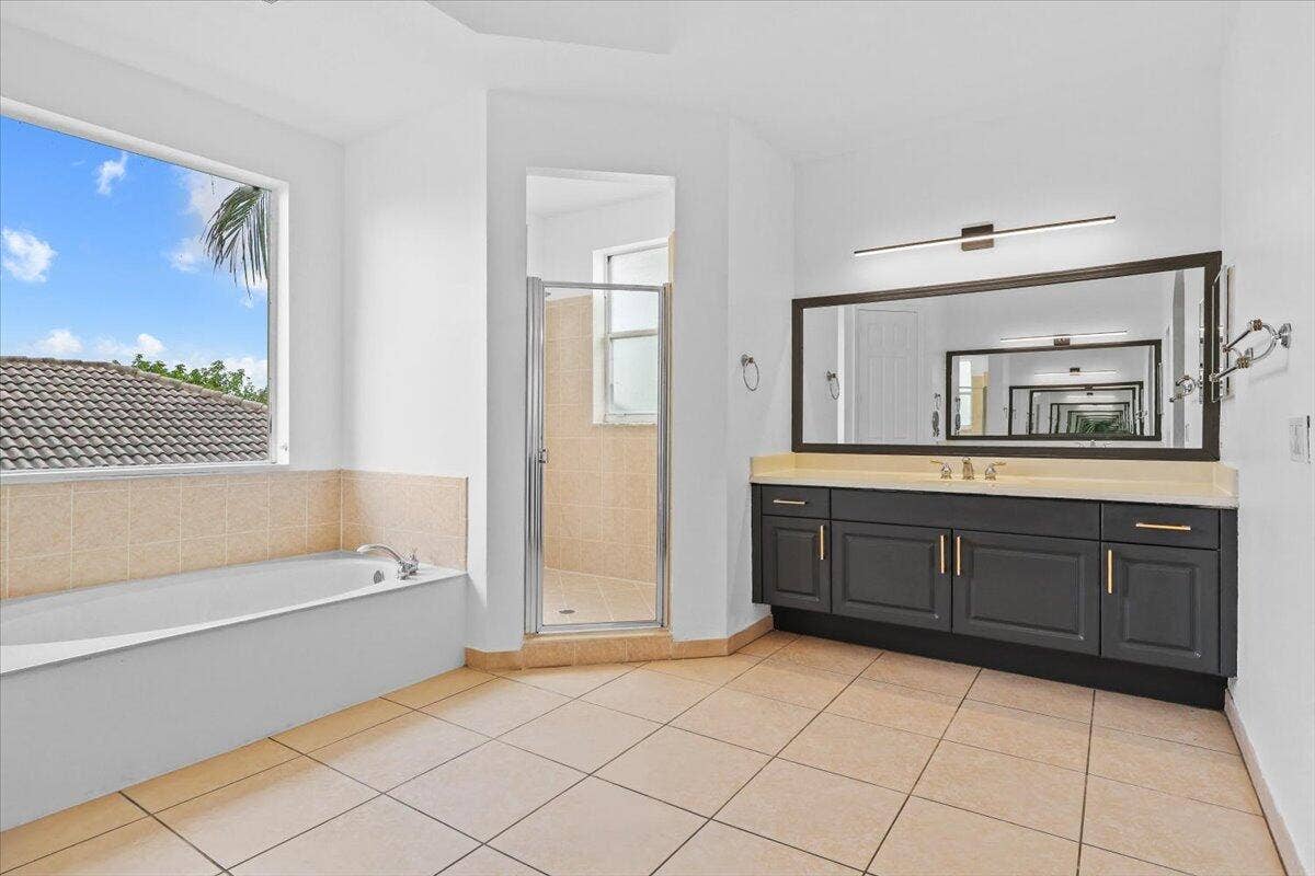 1831 Waldorf Drive E, Royal Palm Beach, FL 33411 EN-SUITE BATHROOM WITH ROYAL TUB IN MAIN MASTER SUITE ON SECOND FLOOR