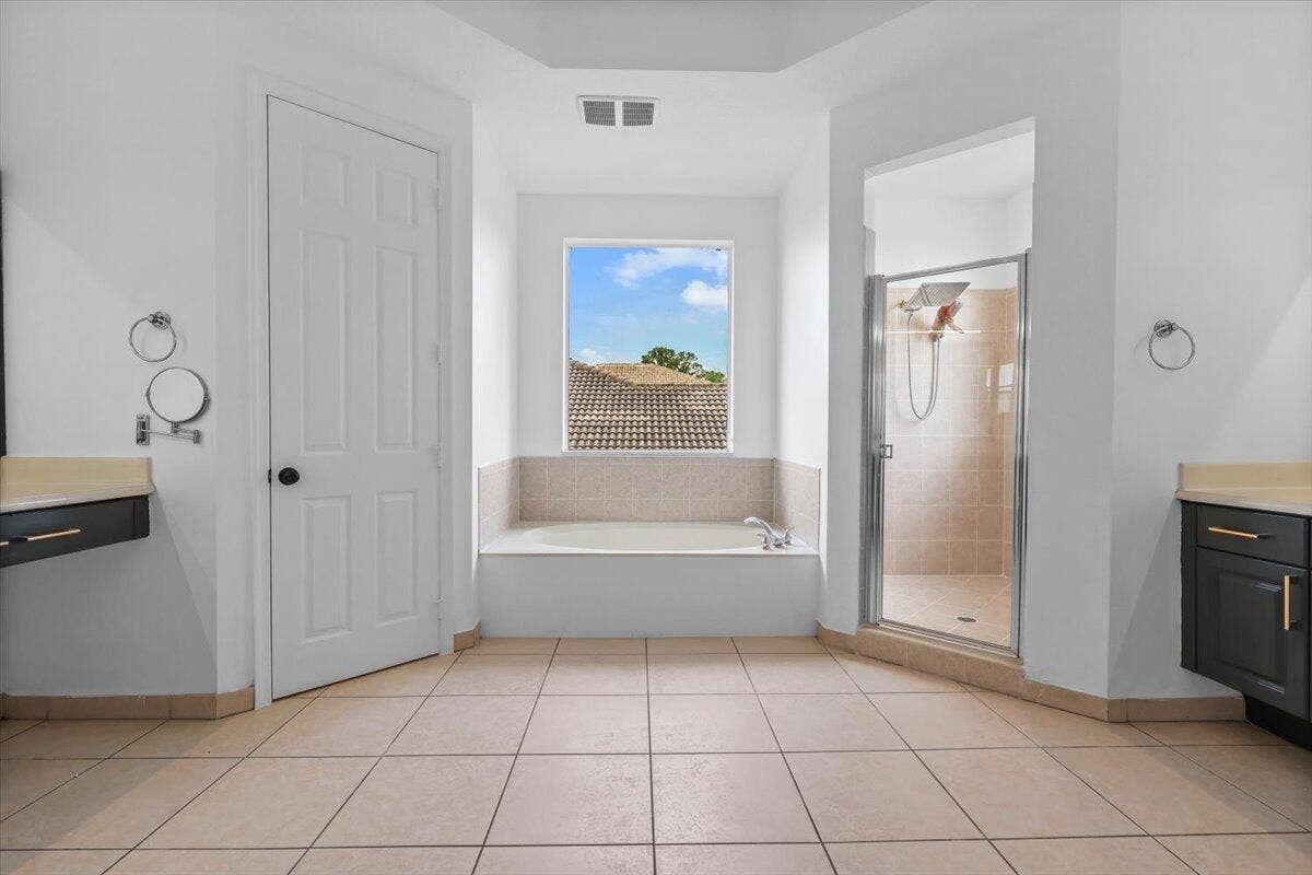 1831 Waldorf Drive E, Royal Palm Beach, FL 33411 EN-SUITE BATHROOM WITH ROYAL TUB IN MAIN MASTER SUITE ON SECOND FLOOR