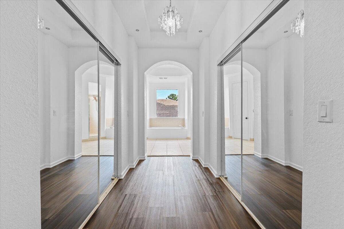 1831 Waldorf Drive E, Royal Palm Beach, FL 33411 EN-SUITE WALK-IN CLOSET HALLWAY IN MAIN MASTER SUITE ON SECOND FLOOR
