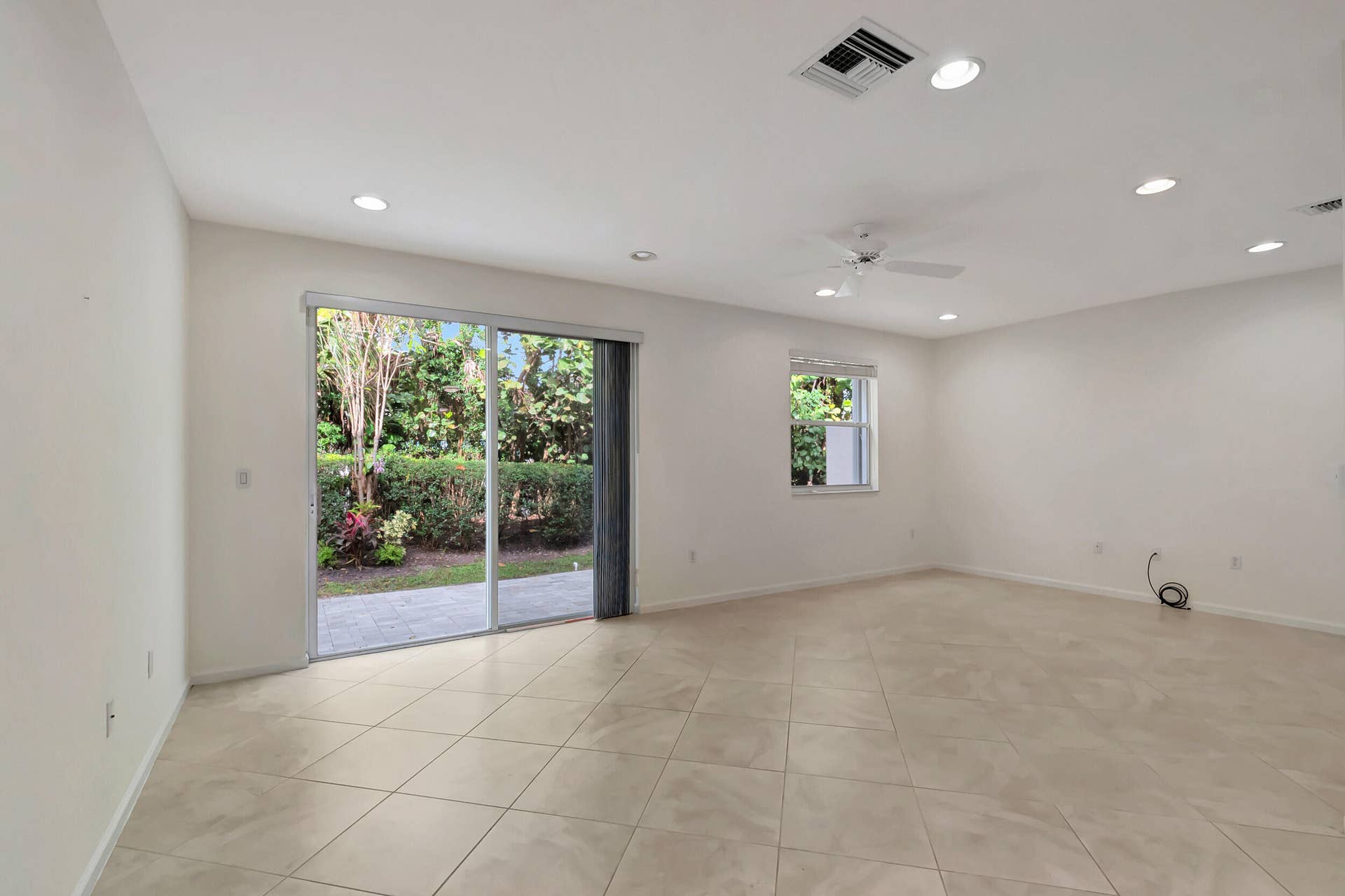 16169 Poppy Seed Circle, Delray Beach, FL 33484 Family room to patio