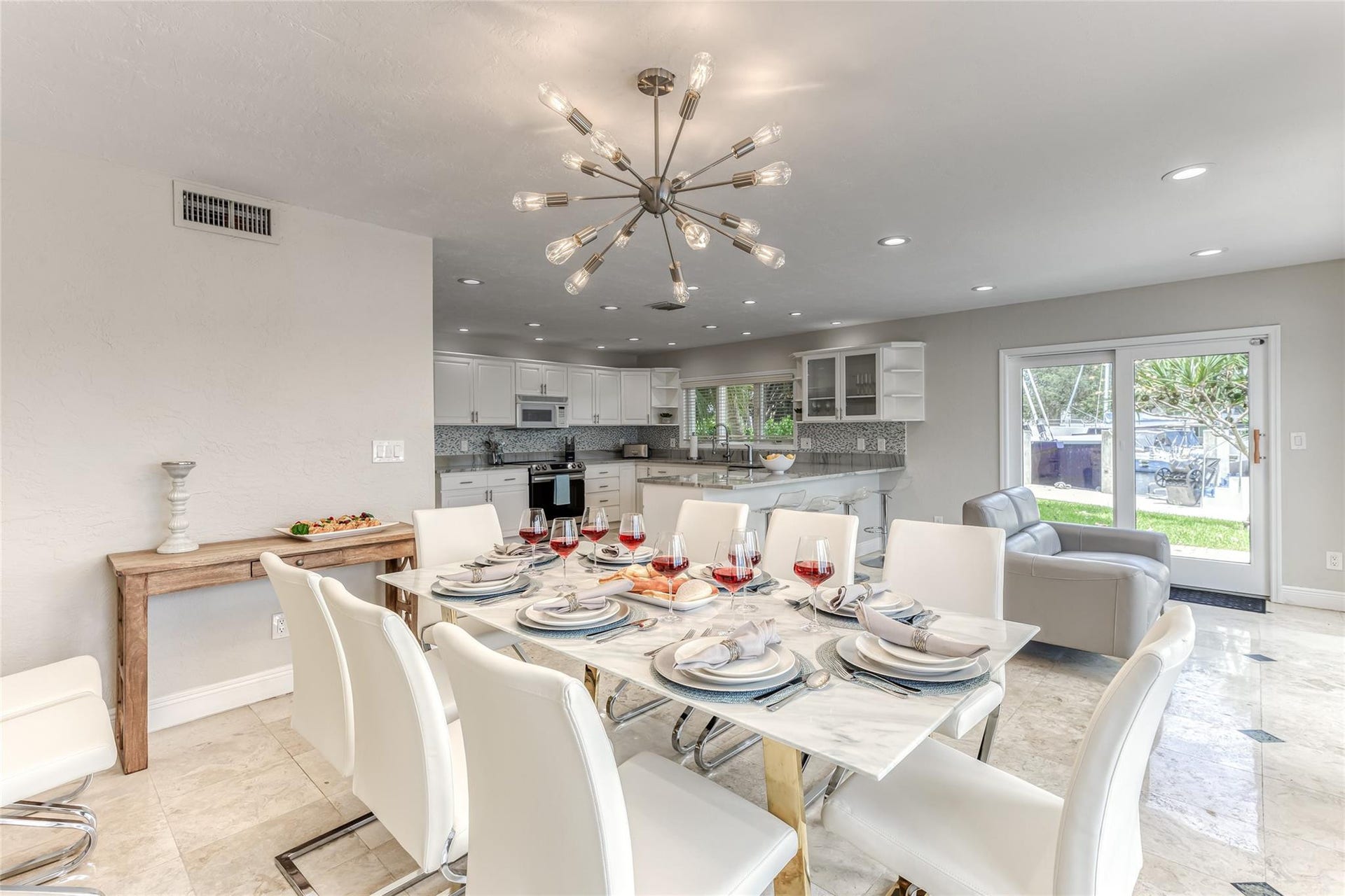 616 1st Key Drive, Fort Lauderdale, FL 33304 Dining Room Seating for 8 of Kitchen overlooking pool & waterway.