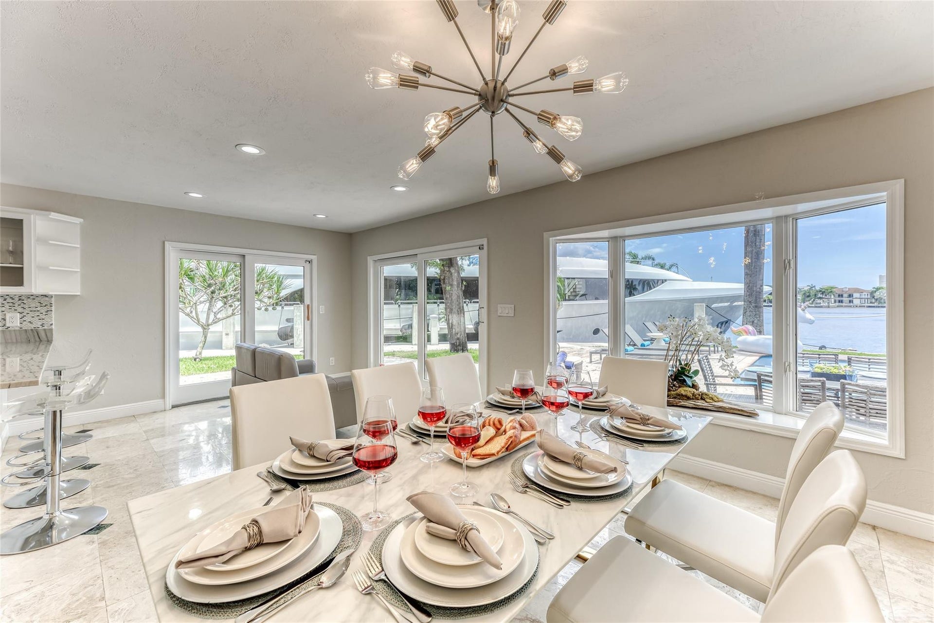 616 1st Key Drive, Fort Lauderdale, FL 33304 Dining Room Seating for 8 of Kitchen overlooking pool & waterway.