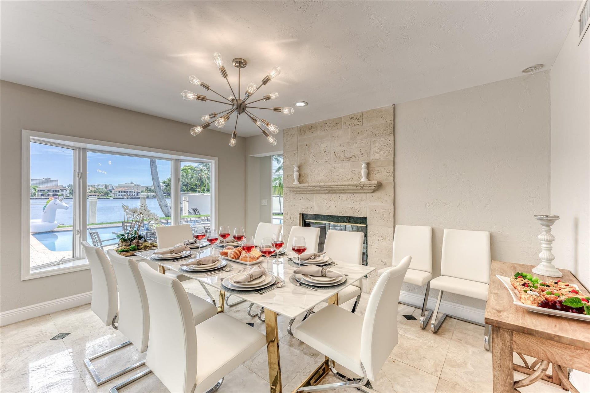 616 1st Key Drive, Fort Lauderdale, FL 33304 Dining Room Seating for 8 of Kitchen overlooking pool & waterway.