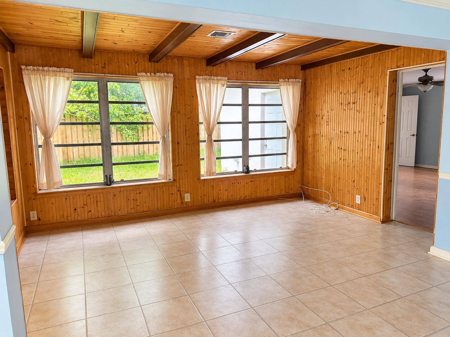 Bright Wood-Paneled Sunroom Interior