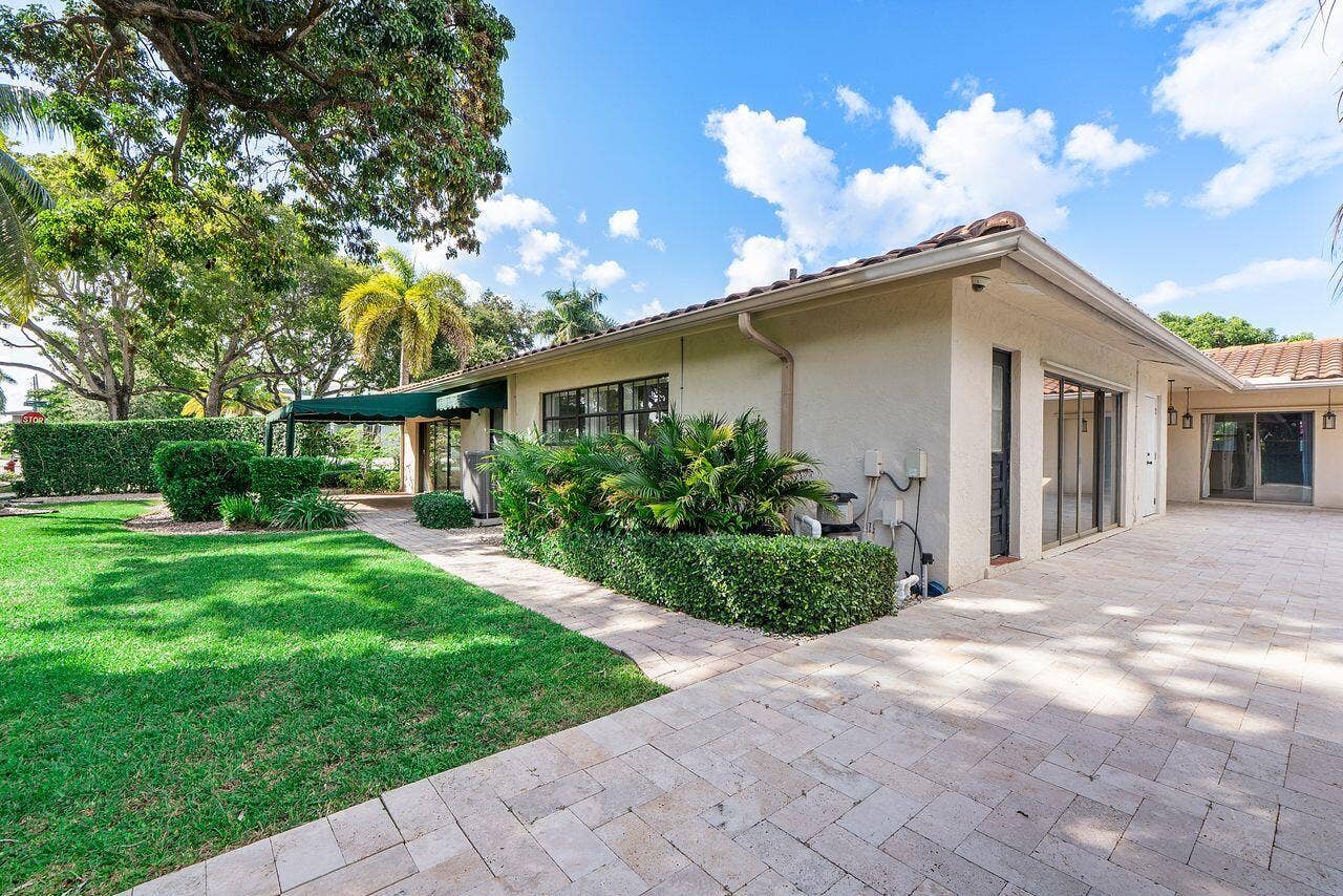 1350 W TERRA MAR Drive, Pompano Beach, FL 33062 South side yard with view of family room