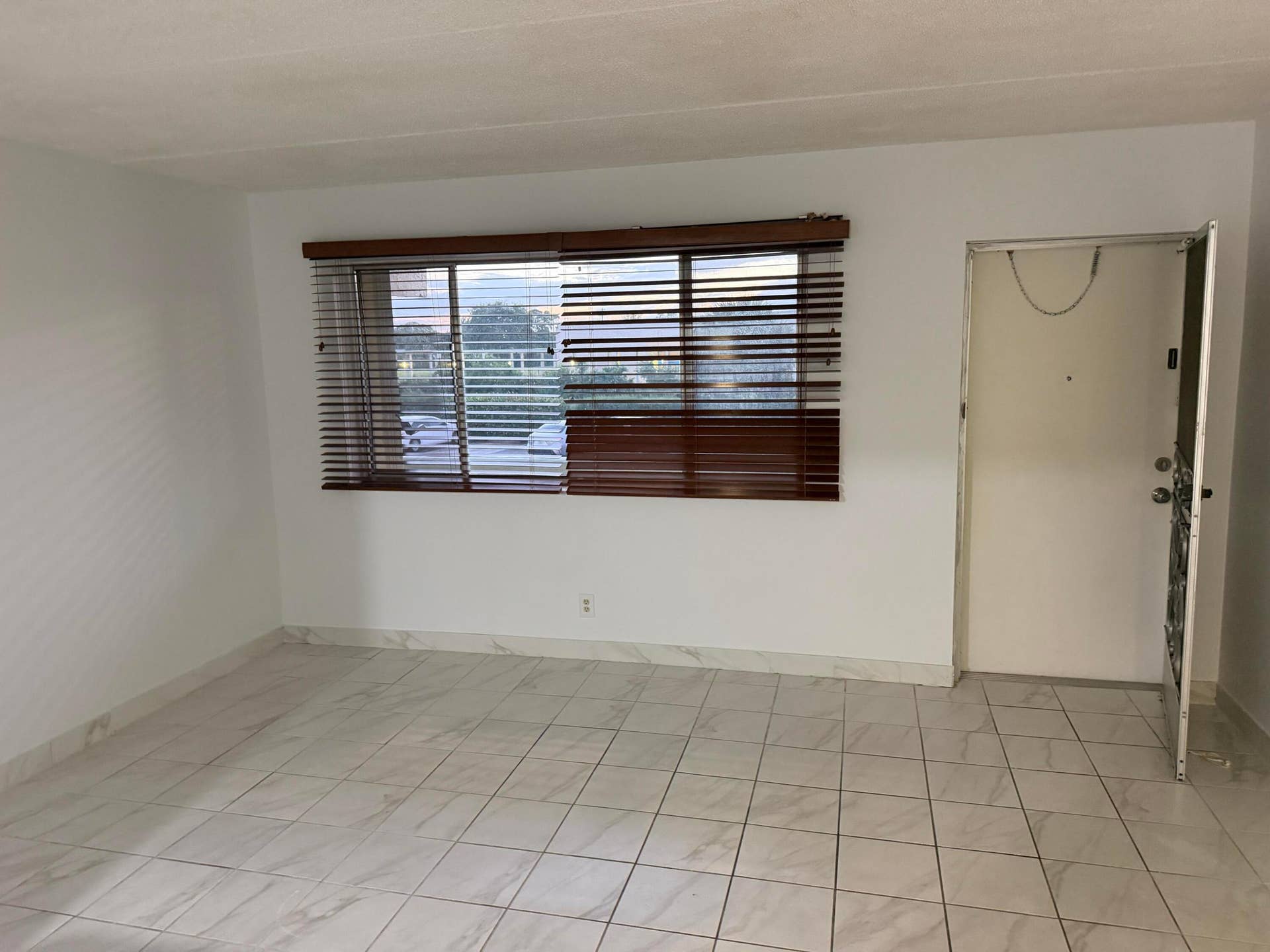400 VILLAGE GREEN Circle W, #205, Palm Springs, FL 33461 Living room- Condo. freshly painted throughout