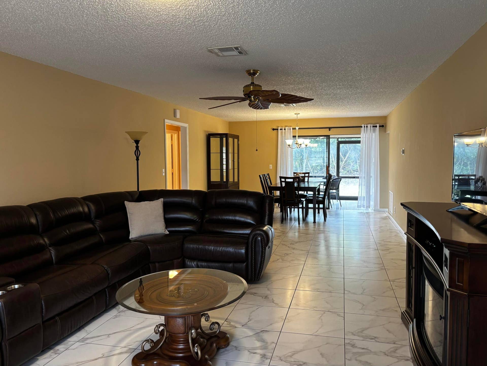 Walk into your open concept living room and dining areas.