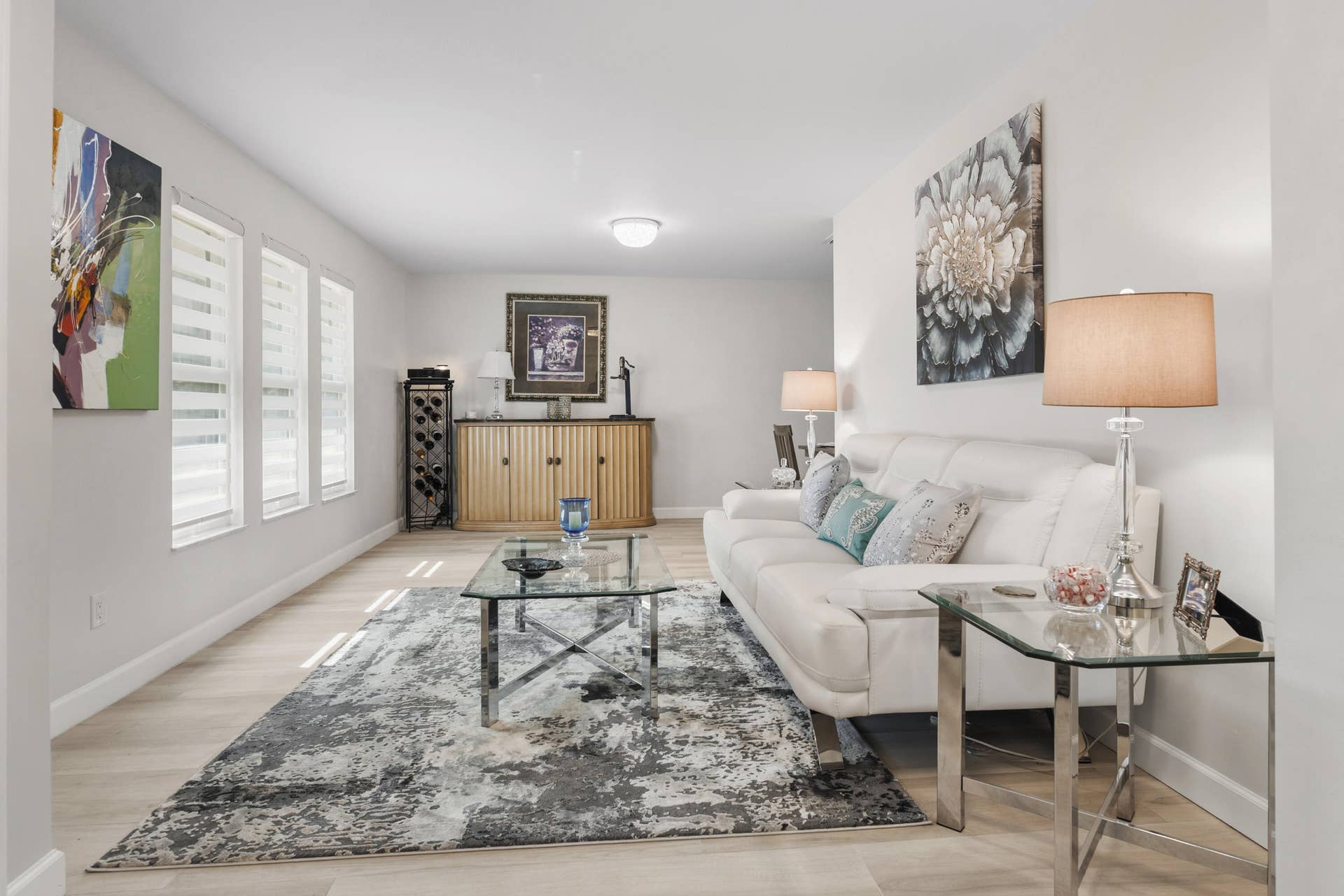 3098 SE BUR Street, Port St Lucie, FL 34952 Beautiful wide-plank flooring, stylish zebra shades, and an inviting layout create the perfect space for relaxing or entertaining.