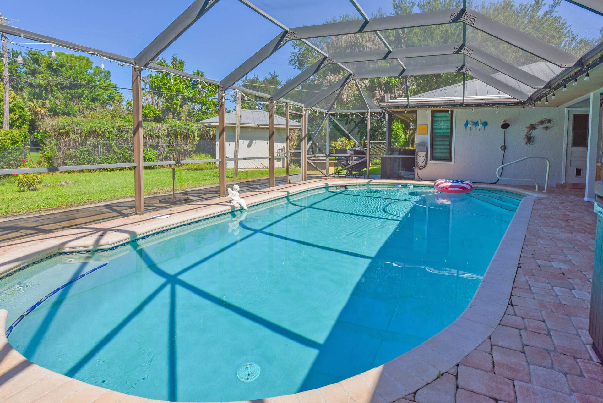 3098 SE BUR Street, Port St Lucie, FL 34952 Take a refreshing dip in your heated saltwater pool! Enjoy a screened enclosure, beautiful paver decking, and your own private backyard retreat.