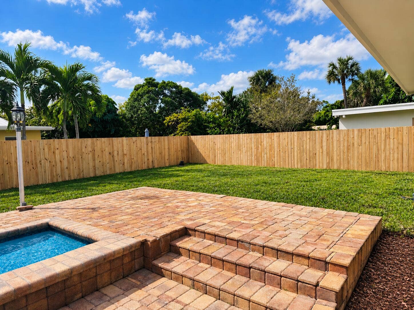 1472 SW 13TH Street, Boca Raton, FL 33486 Sunlit Poolside Patio with Mulch Bed