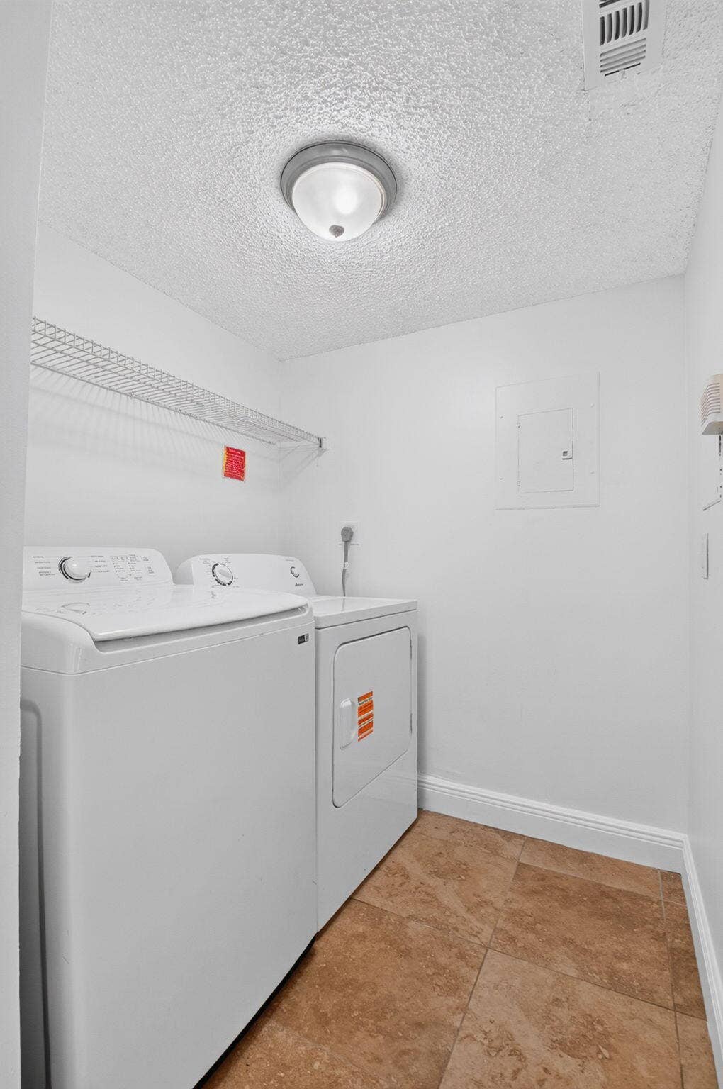 Laundry room with full-size washer/dryer and pantry