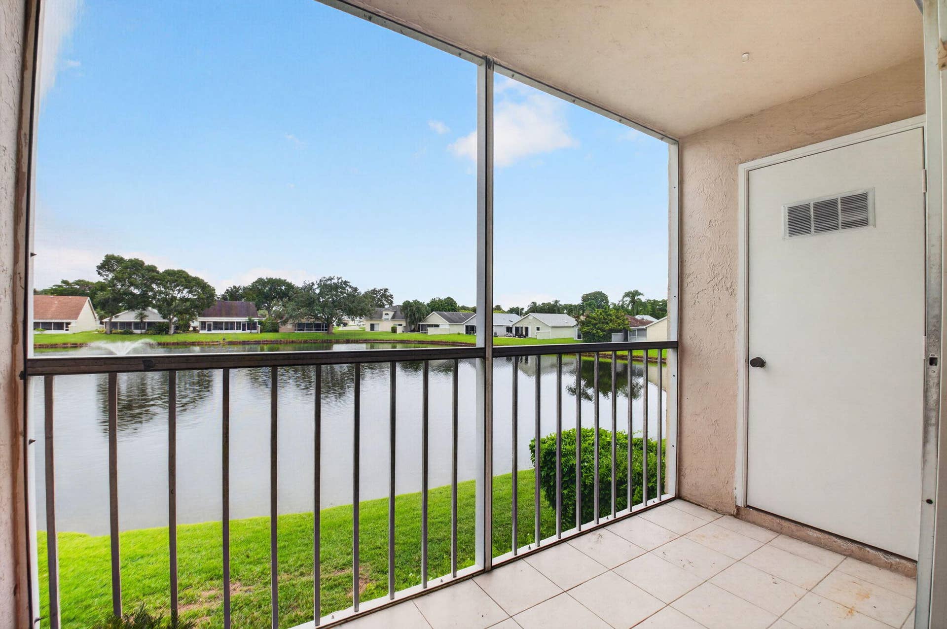 Screened balcony with outdoor storage closet.