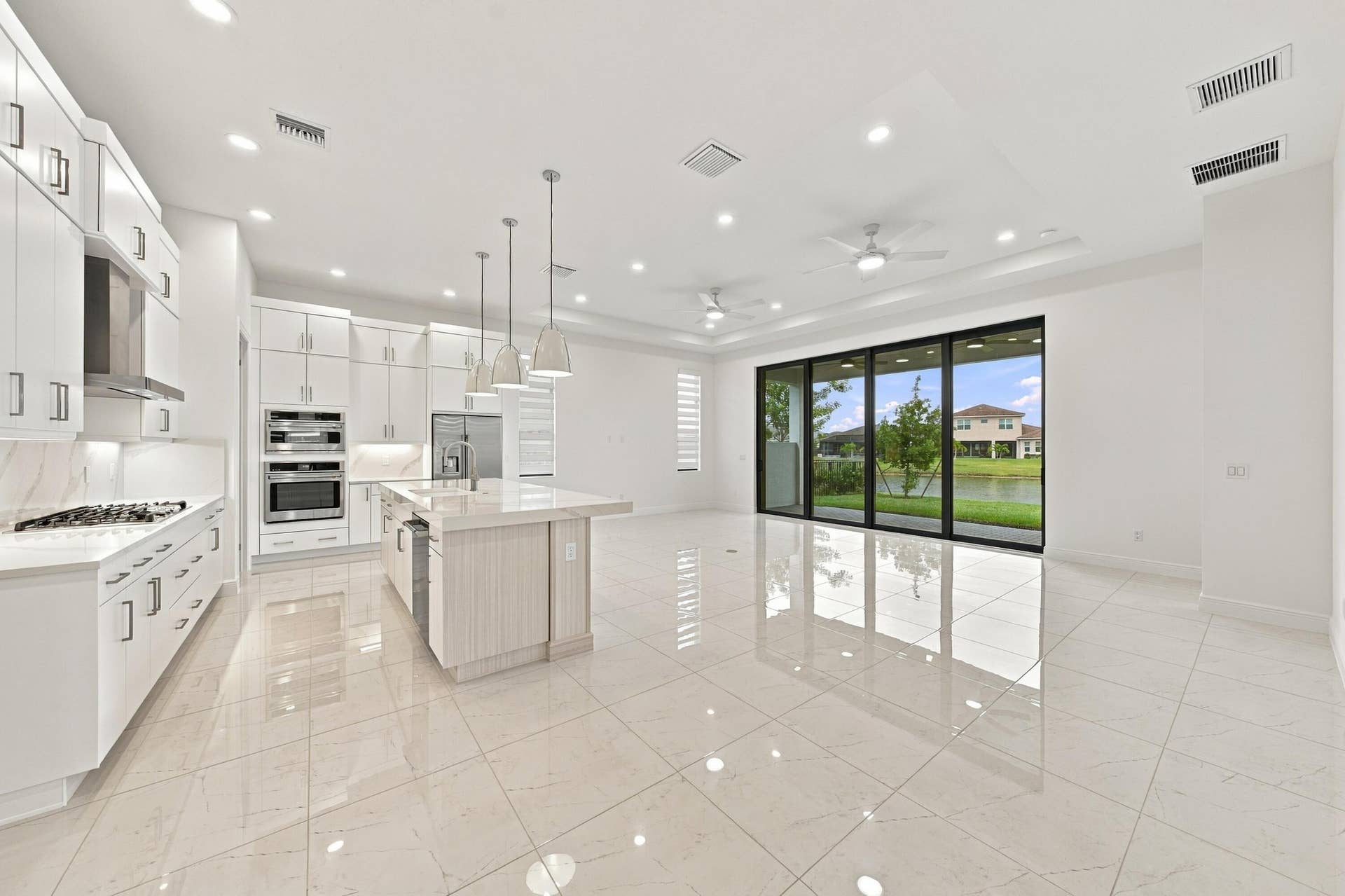 4931 Rivo Alto Circle, Westlake, FL 33470 Great room, kitchen island and dining room