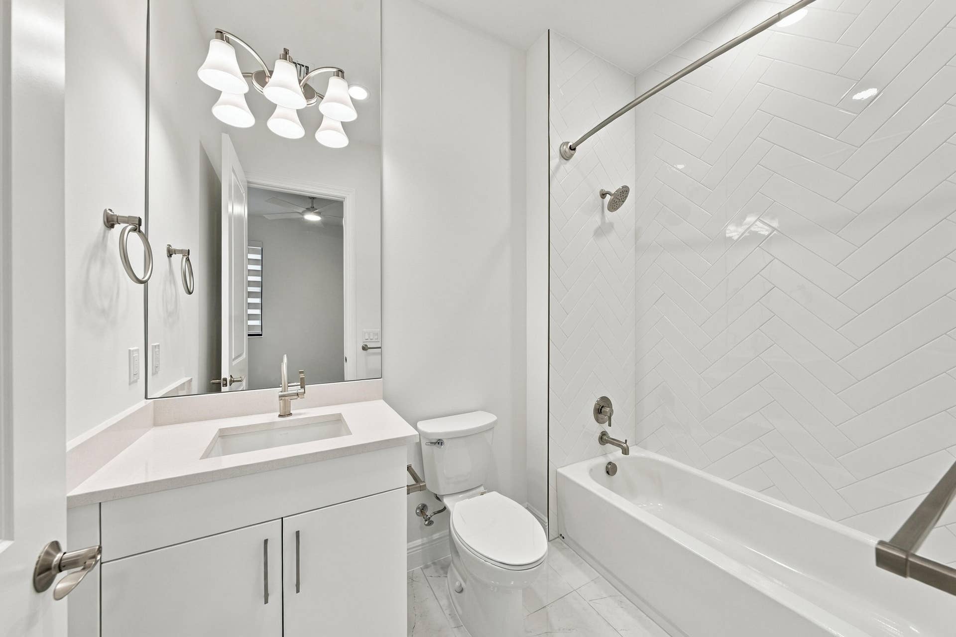 4931 Rivo Alto Circle, Westlake, FL 33470 2nd bathroom with upgraded countertop, cabinets, tub/shower with tile and mirror to the ceiling