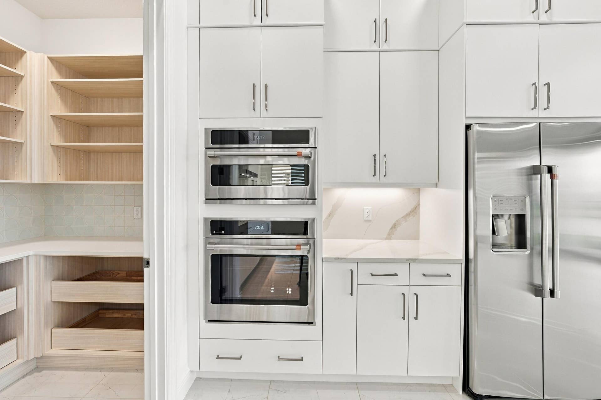 4931 Rivo Alto Circle, Westlake, FL 33470 GE cafe appliances and walk-in built out pantry with quartz countertop/soft close drawers with plenty of stoarge