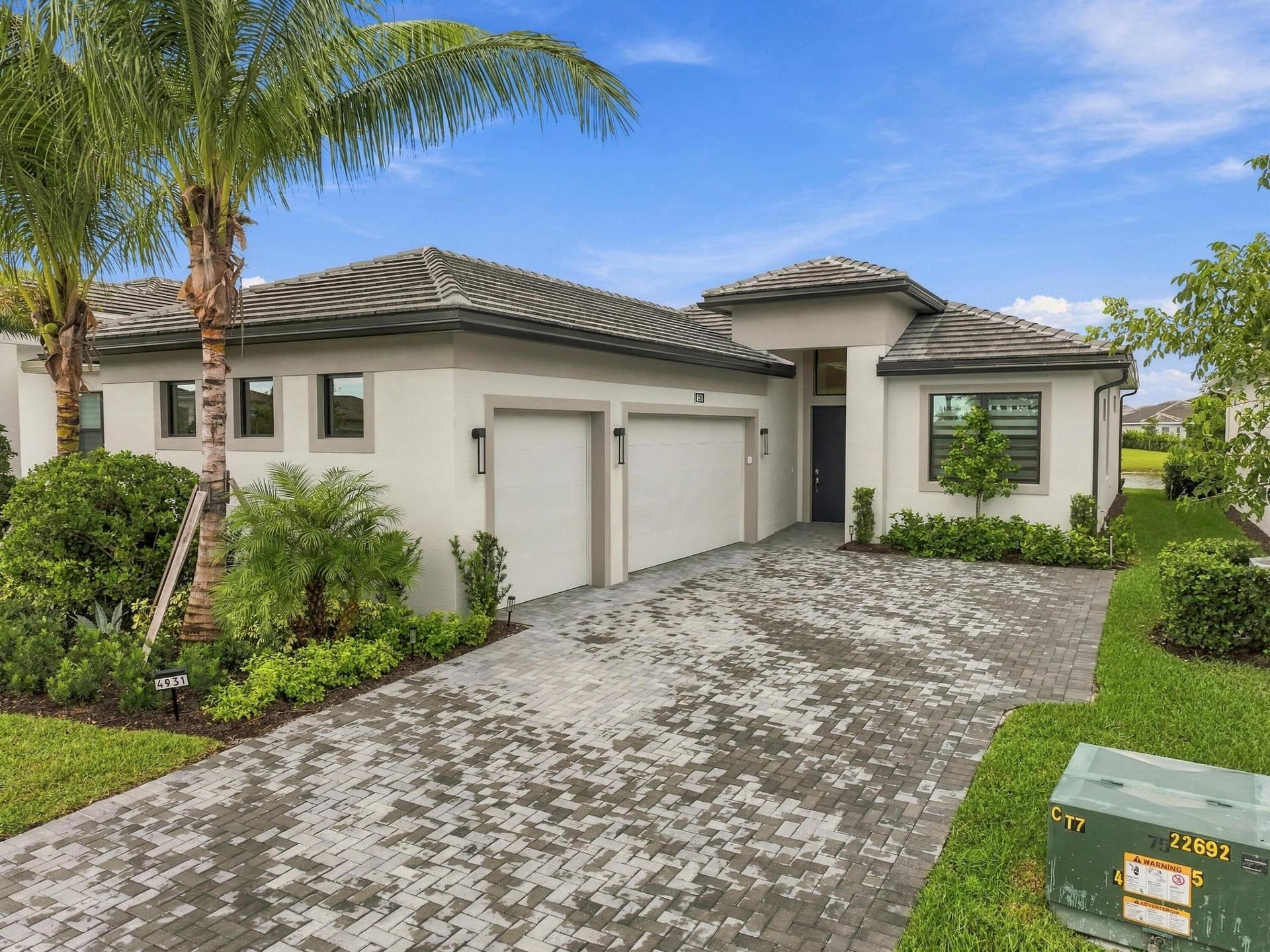 4931 Rivo Alto Circle, Westlake, FL 33470 Lila model with 3 car garage and paved driveway