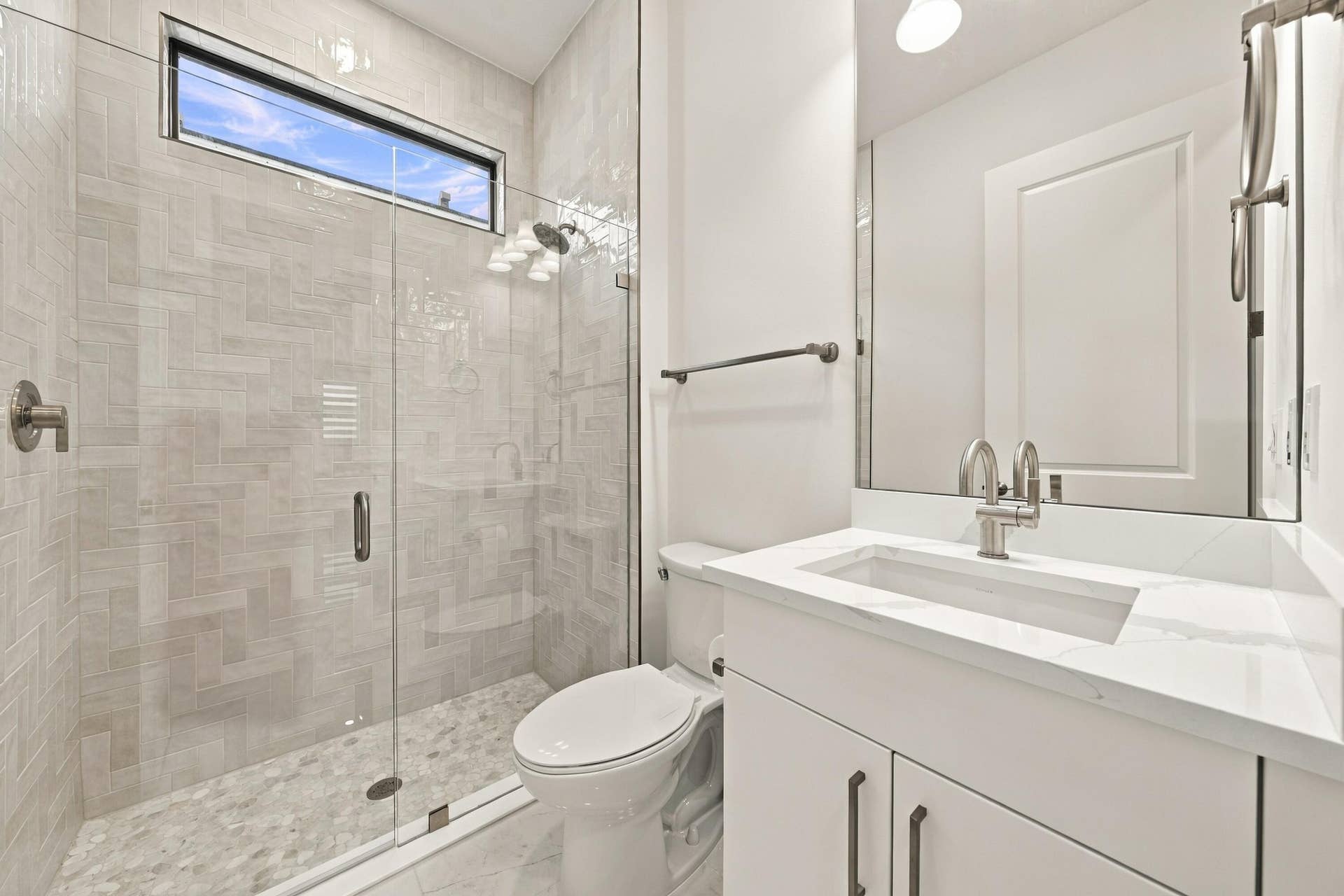 4931 Rivo Alto Circle, Westlake, FL 33470 3rd bathroom, upgraded quartz countertop, upgraded glass frameless shower with tile and mirror to the ceiling