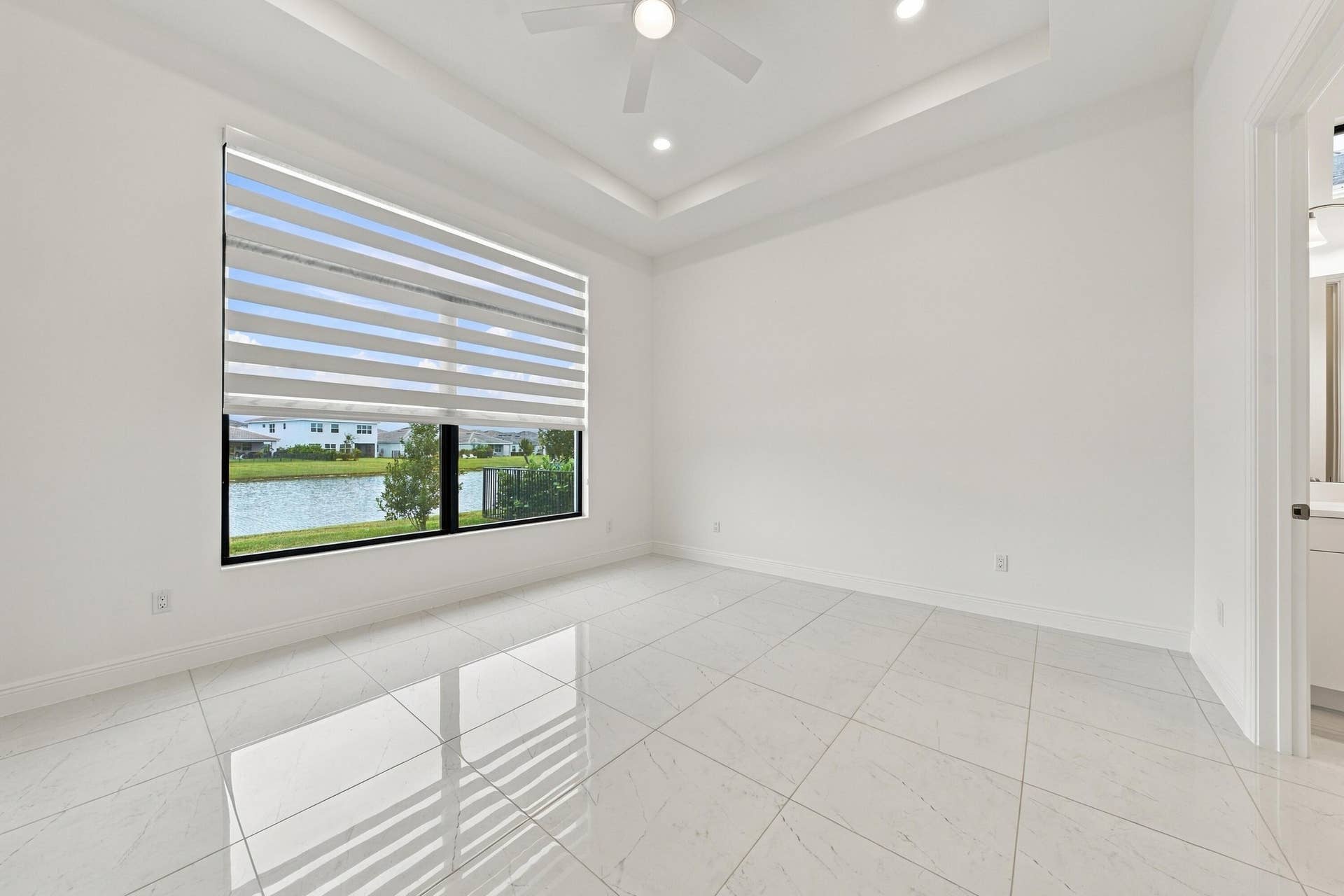 4931 Rivo Alto Circle, Westlake, FL 33470 Primary suite with lakefront views