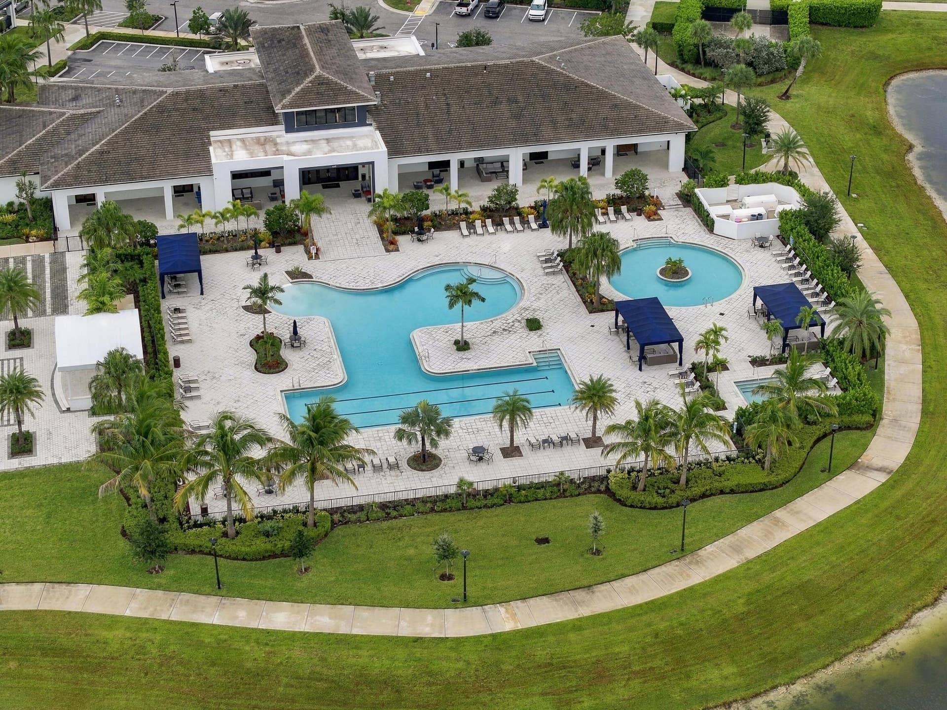 4931 Rivo Alto Circle, Westlake, FL 33470 Cresswind clubhouse zero entry resort style pool with lap area, resistance pool, hot tub and cabanas