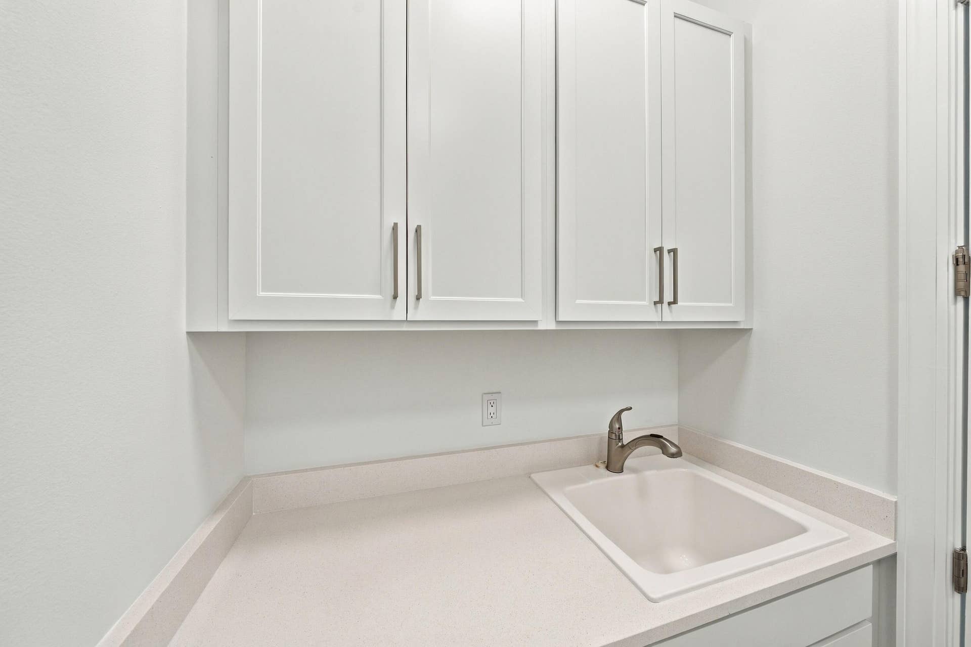 4931 Rivo Alto Circle, Westlake, FL 33470 Laundry room upgraded countertop/sink with upper and lower cabinets