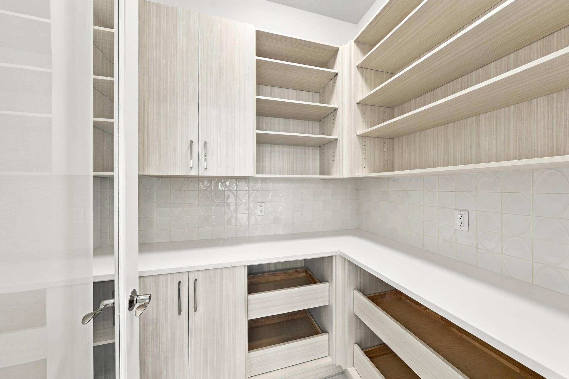 4931 Rivo Alto Circle, Westlake, FL 33470 Walk in pantry with upgraded cabinets, drawers, countertops, backsplash and glass door