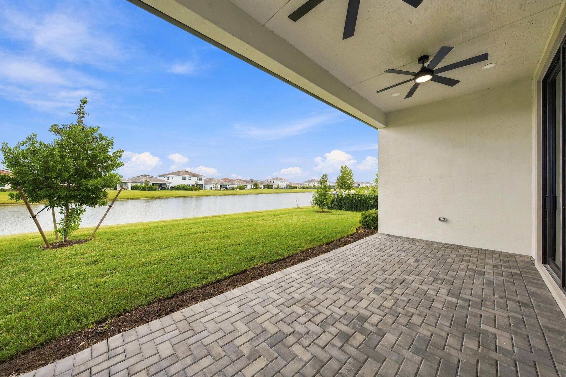 4931 Rivo Alto Circle, Westlake, FL 33470 Covered lanai with pavers lakefront