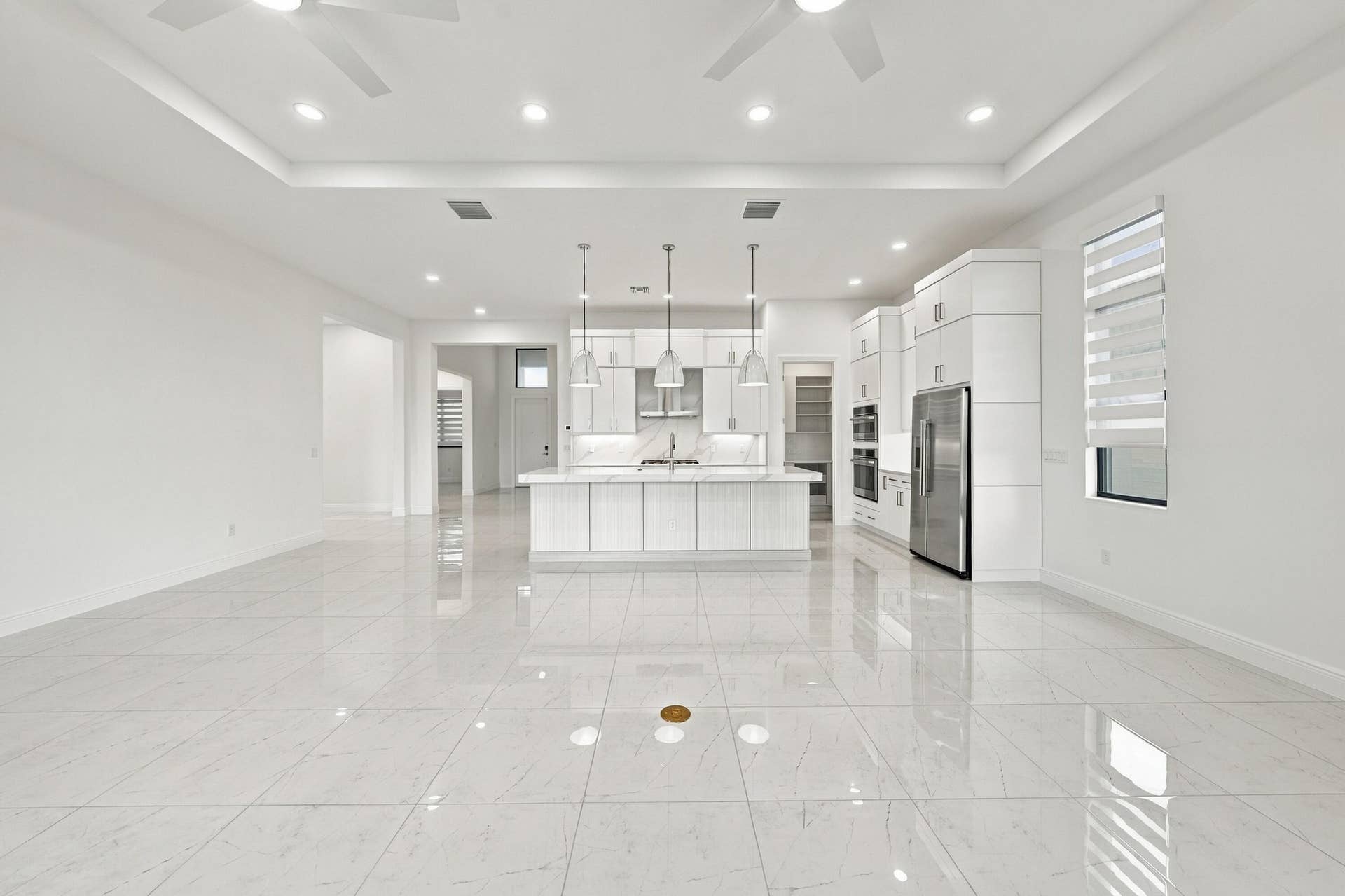 4931 Rivo Alto Circle, Westlake, FL 33470 From sliding glass doors into great room, dining room and kitchen