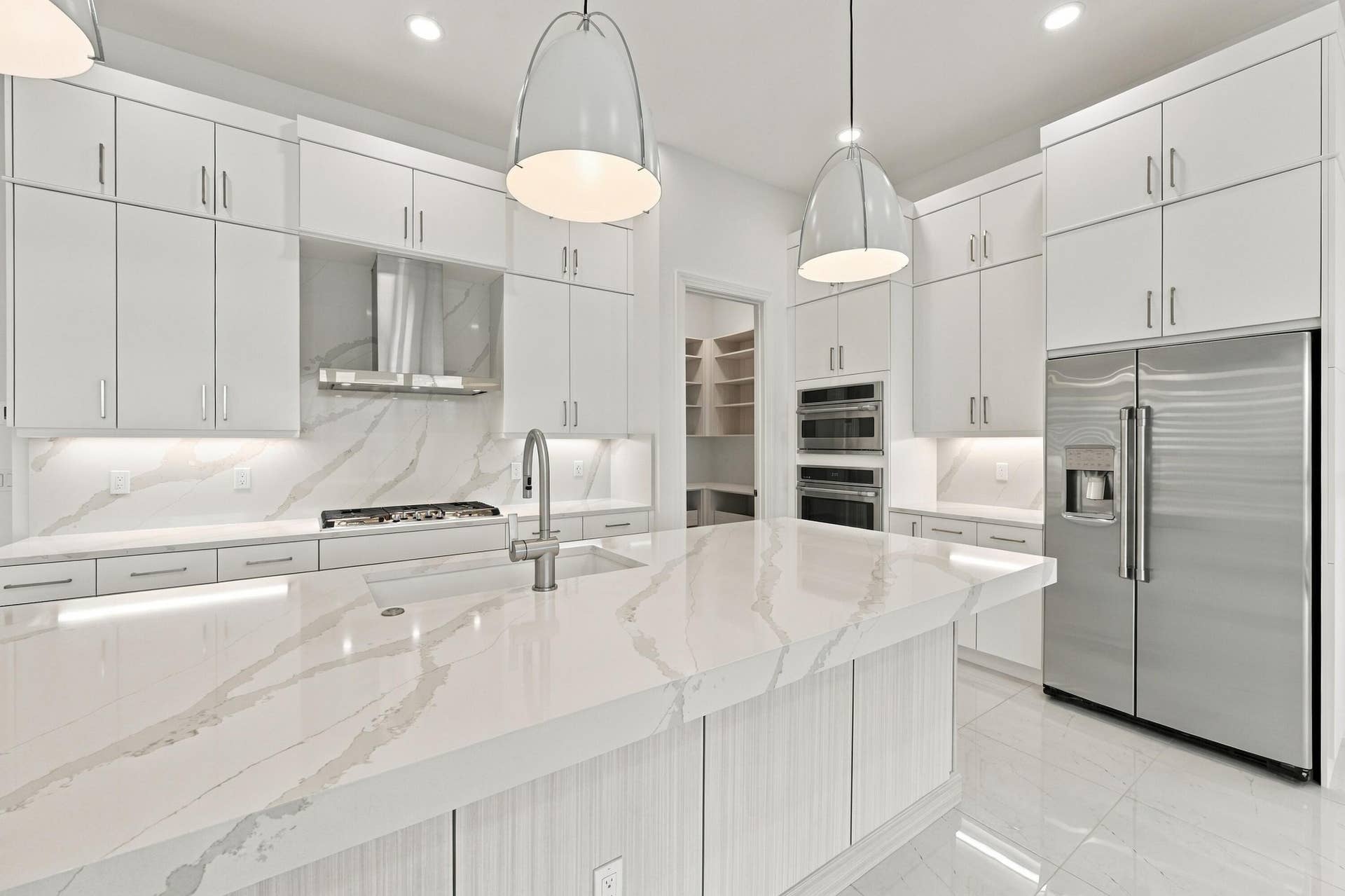 4931 Rivo Alto Circle, Westlake, FL 33470 Upgraded soft close doors and cabinets with crown molding, under cabinet lighting and granite sink