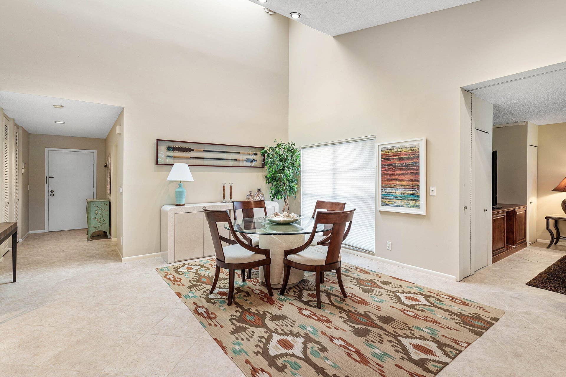 53 EASTGATE Drive, #B, Boynton Beach, FL 33436 High-ceiling interior space featuring a skylight, neutral-toned tile flooring, and recessed lighting