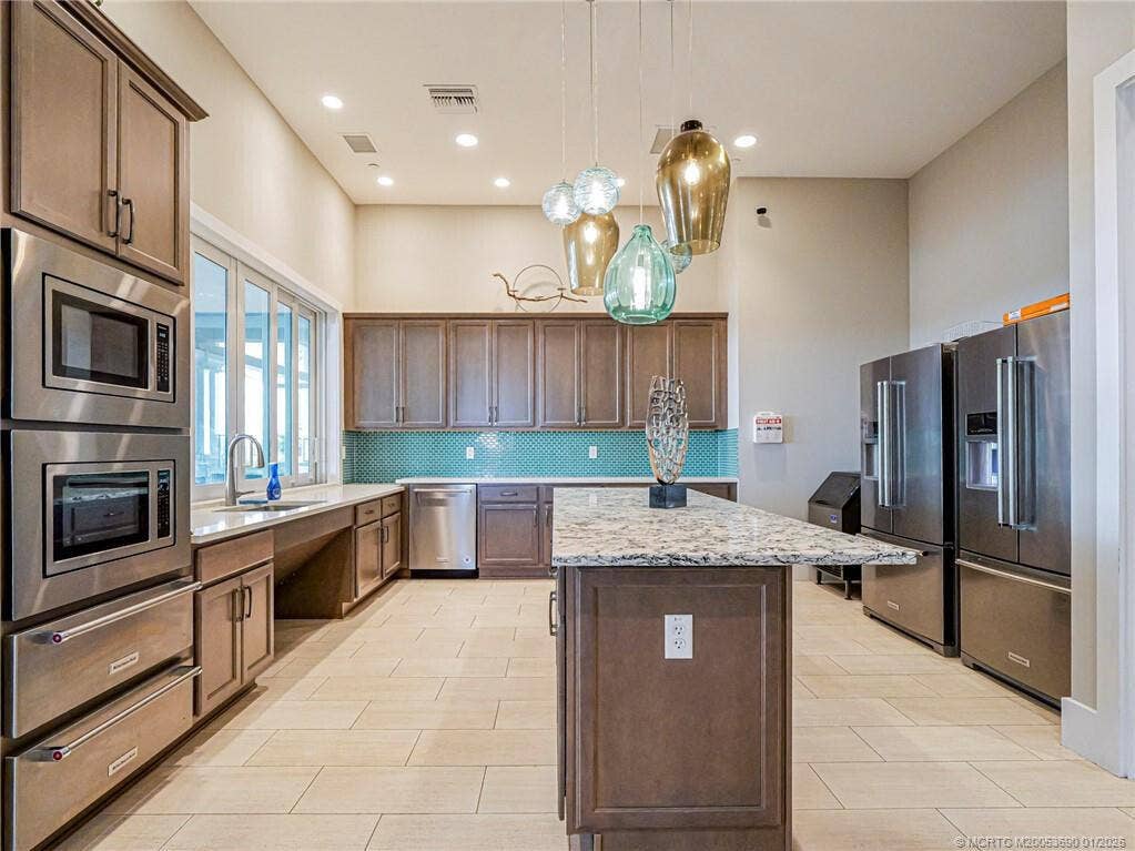 13580 SW GINGERLINE Drive, Port St Lucie, FL 34987 kitchen at clubhouse