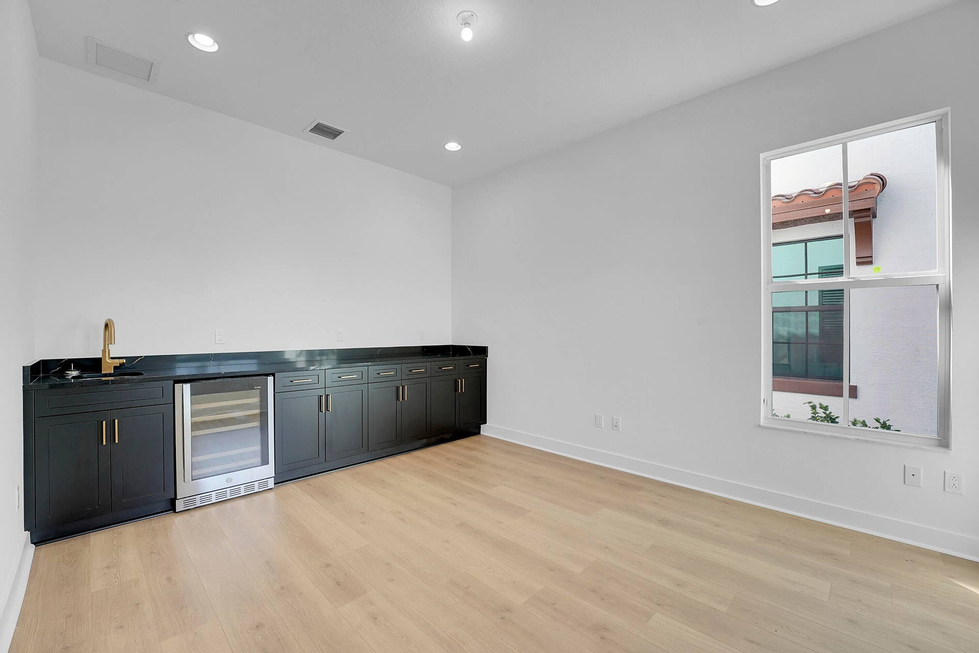 13496 BERNOULLI Way, Palm Beach Gardens, FL 33418 Den w/ Wet Bar and beverage frig