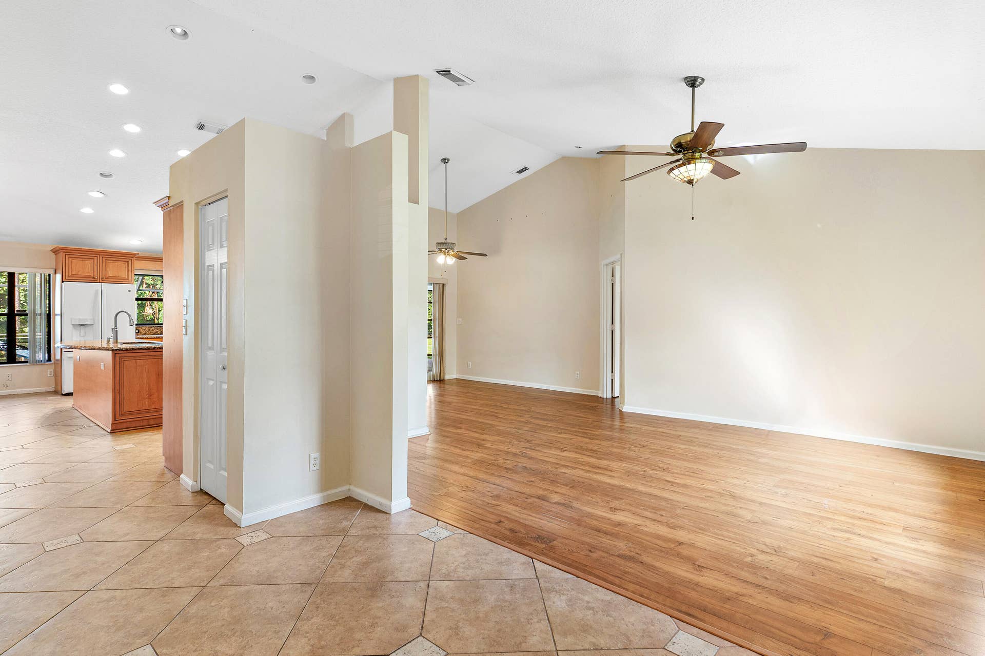 13677 Citrus Grove Boulevard, West Palm Beach, FL 33412 Vaulted ceilings, wood-finish flooring, recessed lighting, ceiling fans, and ceramic tile flooring