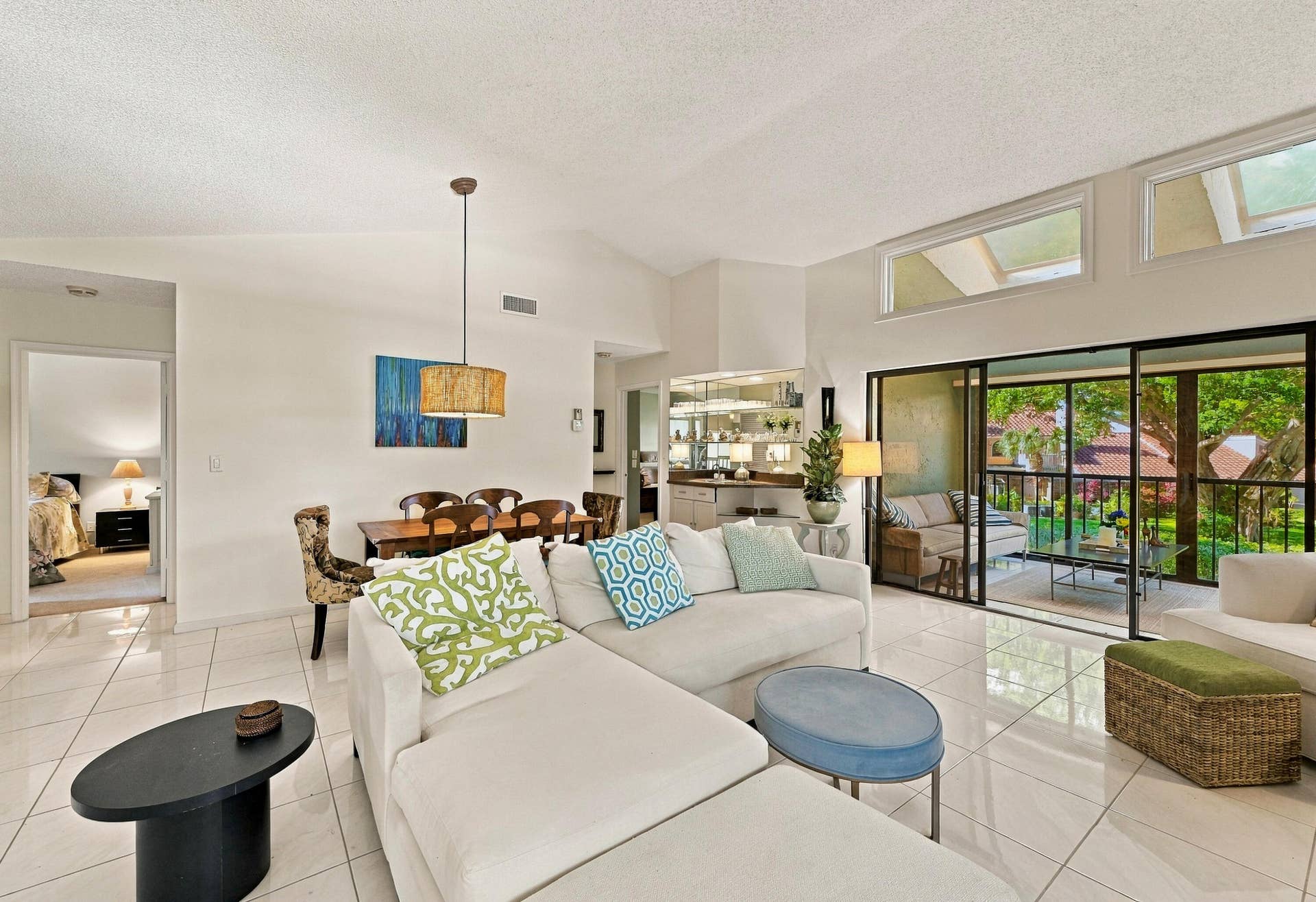 7858 GRANADA Place, #404, Boca Raton, FL 33433 Your living room/dining room has high ceilings and a pretty, green view