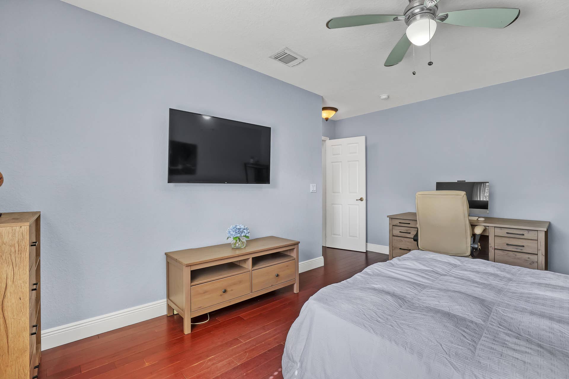 762 GAZETTA Way, West Palm Beach, FL 33413 Wood-finish flooring, ceiling fan with integrated lighting, and a six-panel interior door