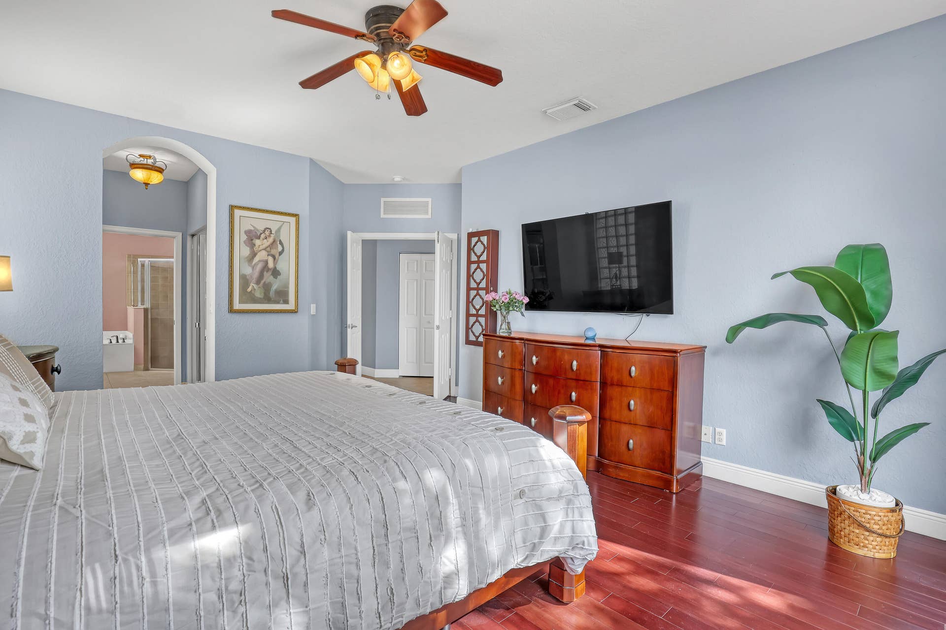 762 GAZETTA Way, West Palm Beach, FL 33413 Room featuring dark wood-finish flooring, vaulted ceiling with a multi-blade light fixture
