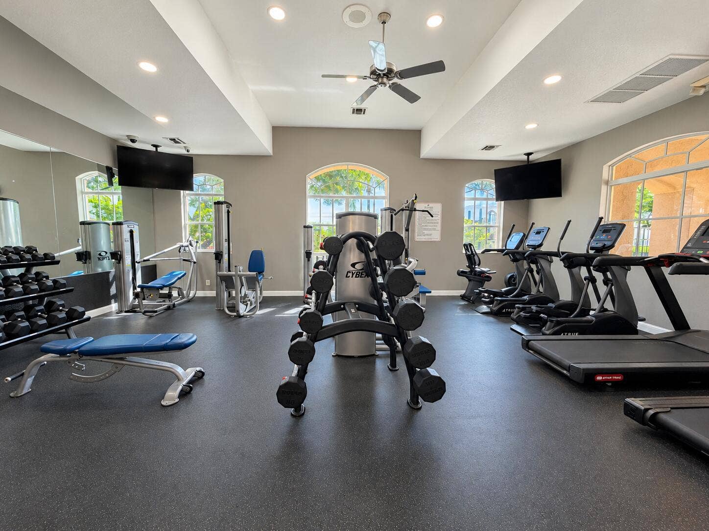 762 GAZETTA Way, West Palm Beach, FL 33413 Fitness center featuring high ceilings, recessed lighting, rubberized flooring, ceiling fan, and arched windows