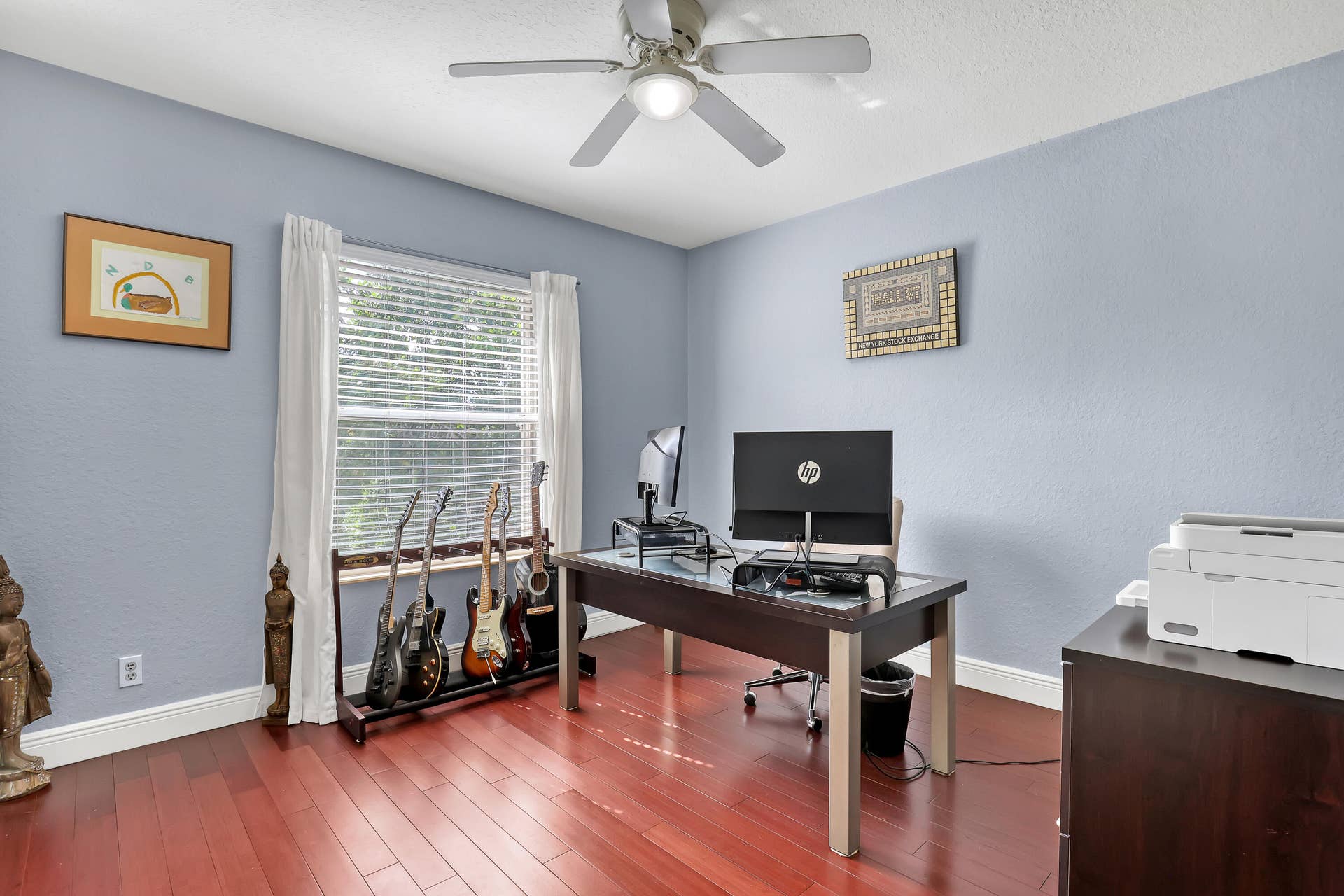 762 GAZETTA Way, West Palm Beach, FL 33413 Room featuring wood-finish flooring, a neutral wall finish, and a ceiling fan with integrated lighting