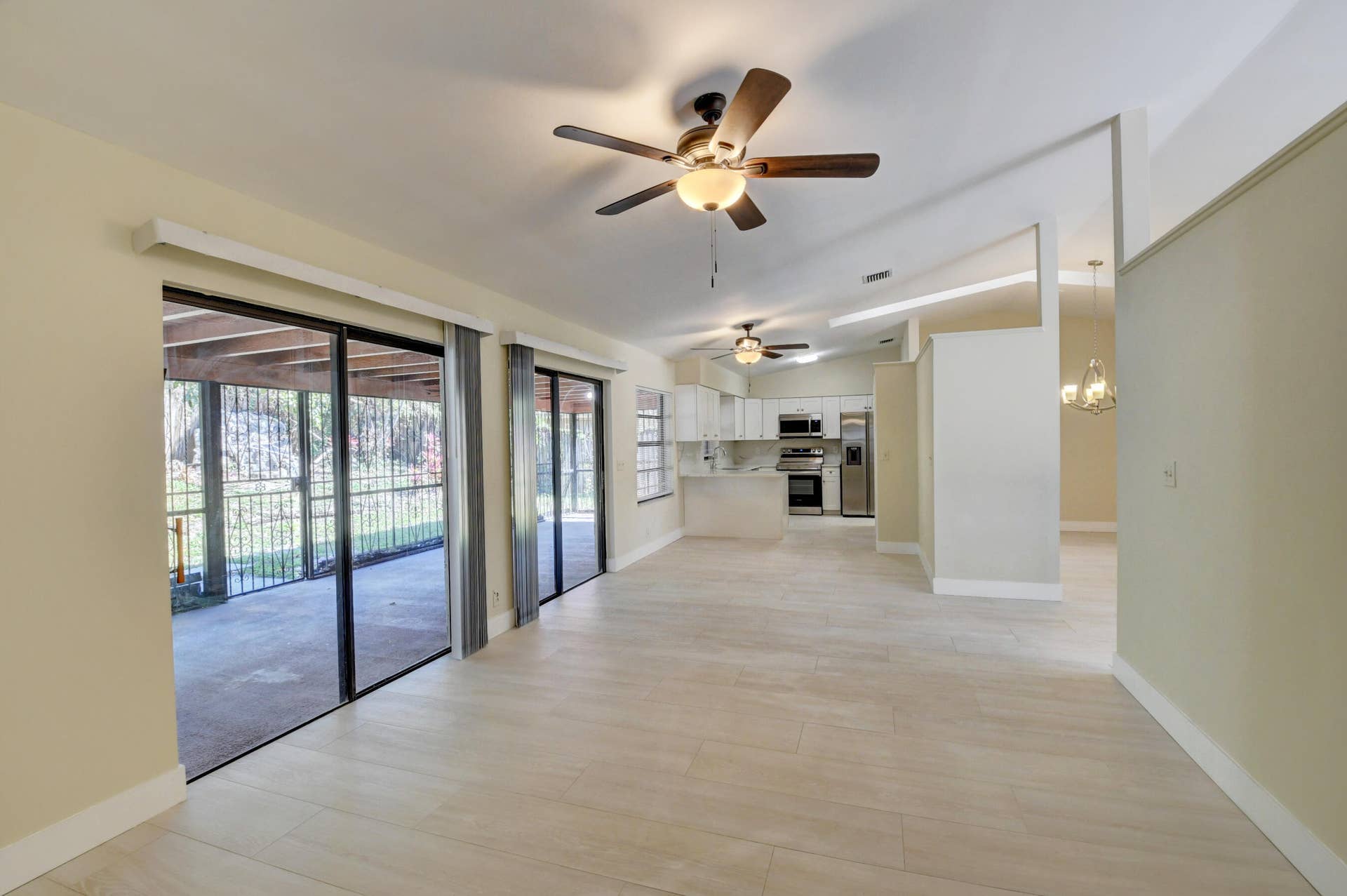 Spacious Living Area with Sliding Glass Doors & Abundant Natural Light