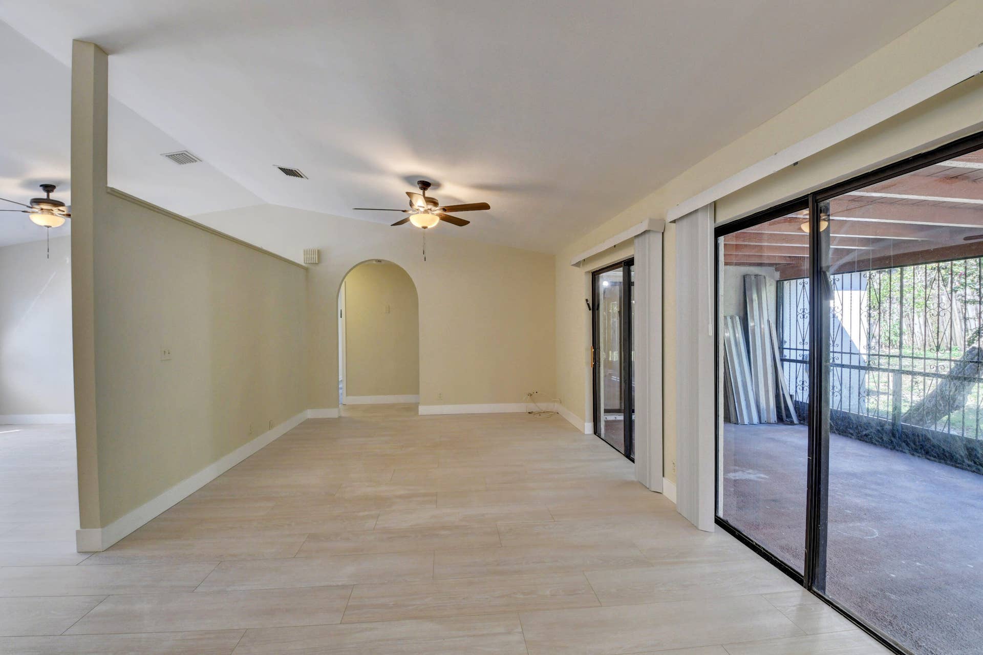 Spacious Living Area with Sliding Glass Doors & Abundant Natural Light