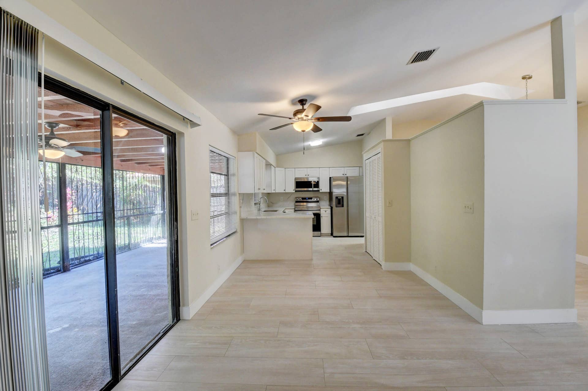 Spacious Living Area with Sliding Glass Doors & Abundant Natural Light
